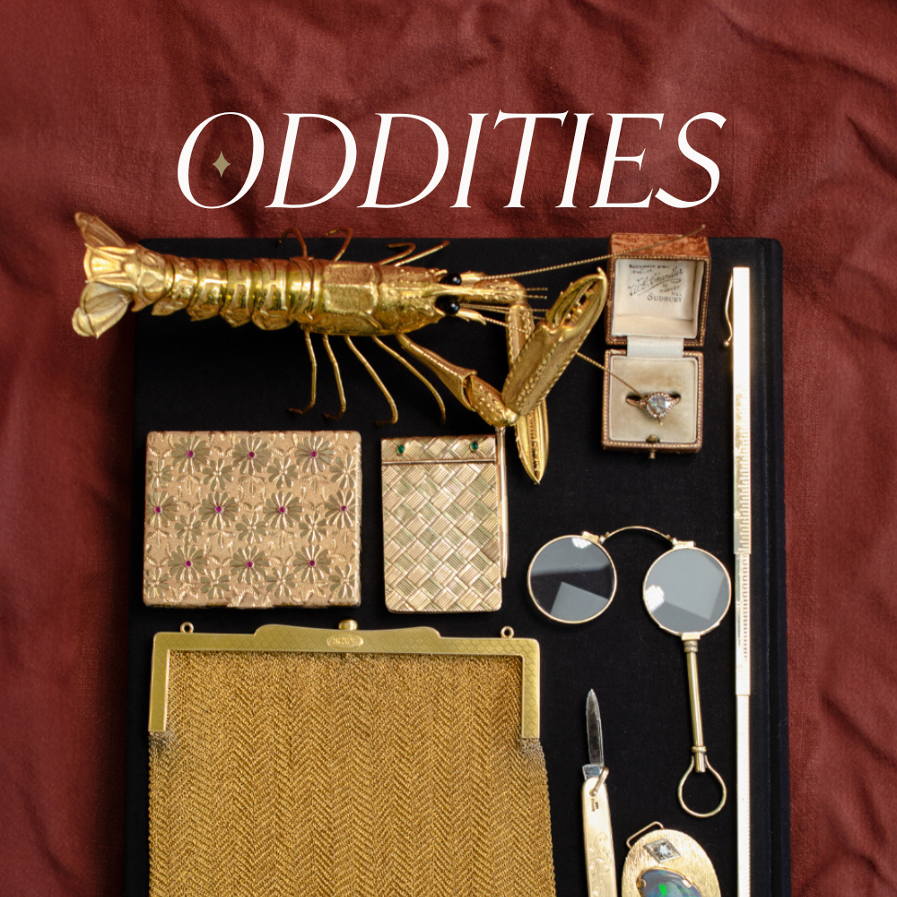 a collection of unique gold items from kinetic jewellery to reading glasses and a notebook, at the centre a Gold insect sculpture, on a red background, featuring the word 'ODDITIES'.
