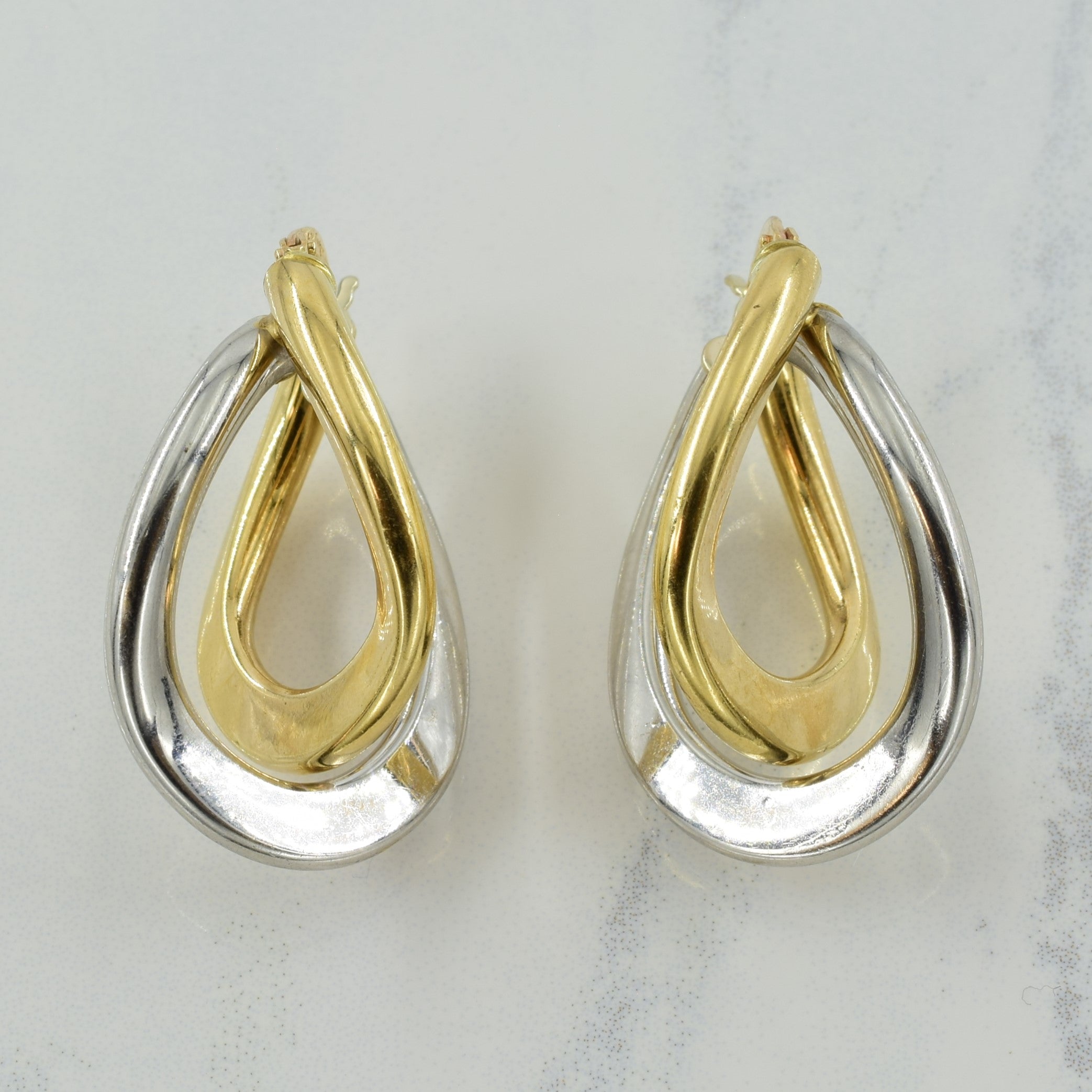 Boucles d'oreilles créoles bicolores en or 10 carats
