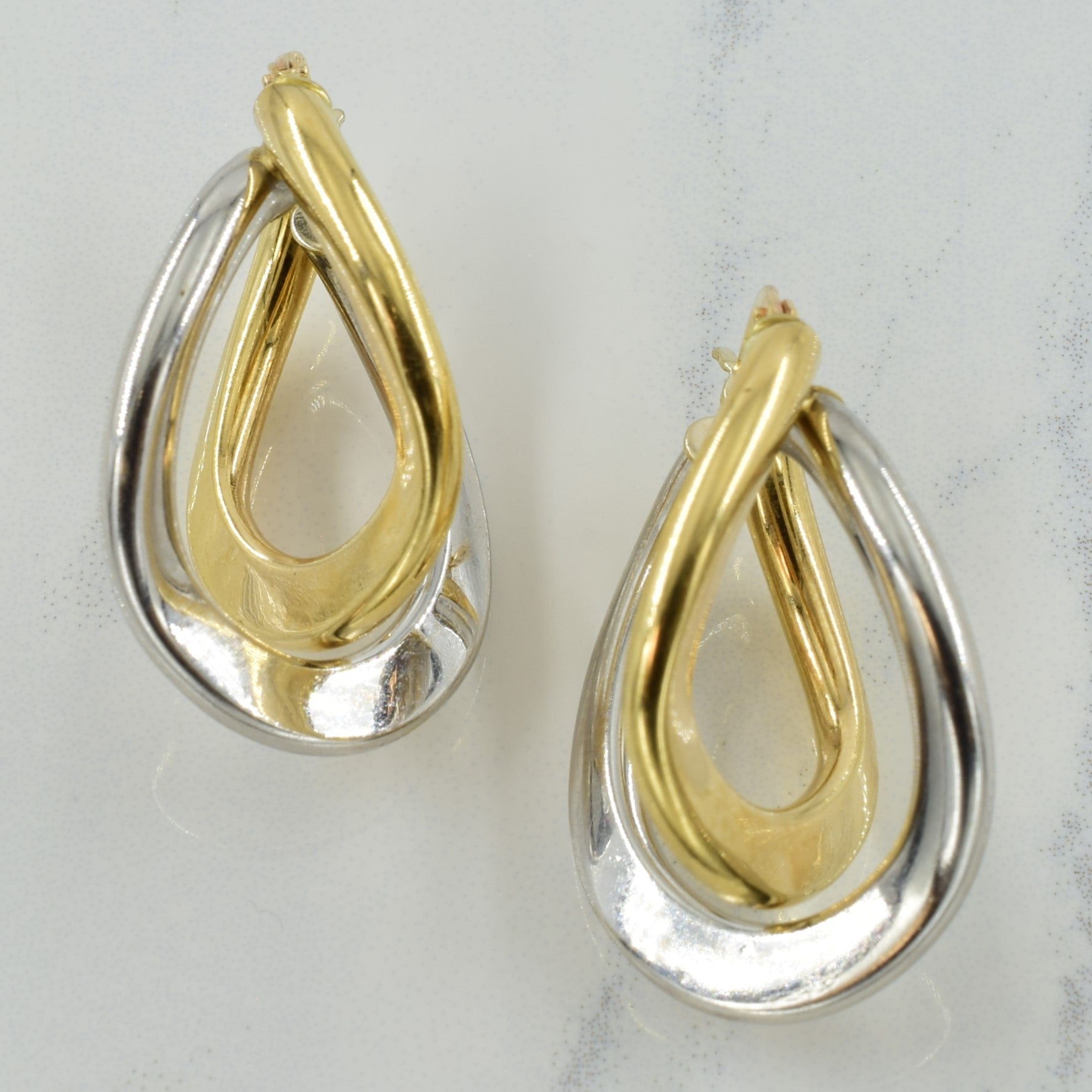 Boucles d'oreilles créoles bicolores en or 10 carats