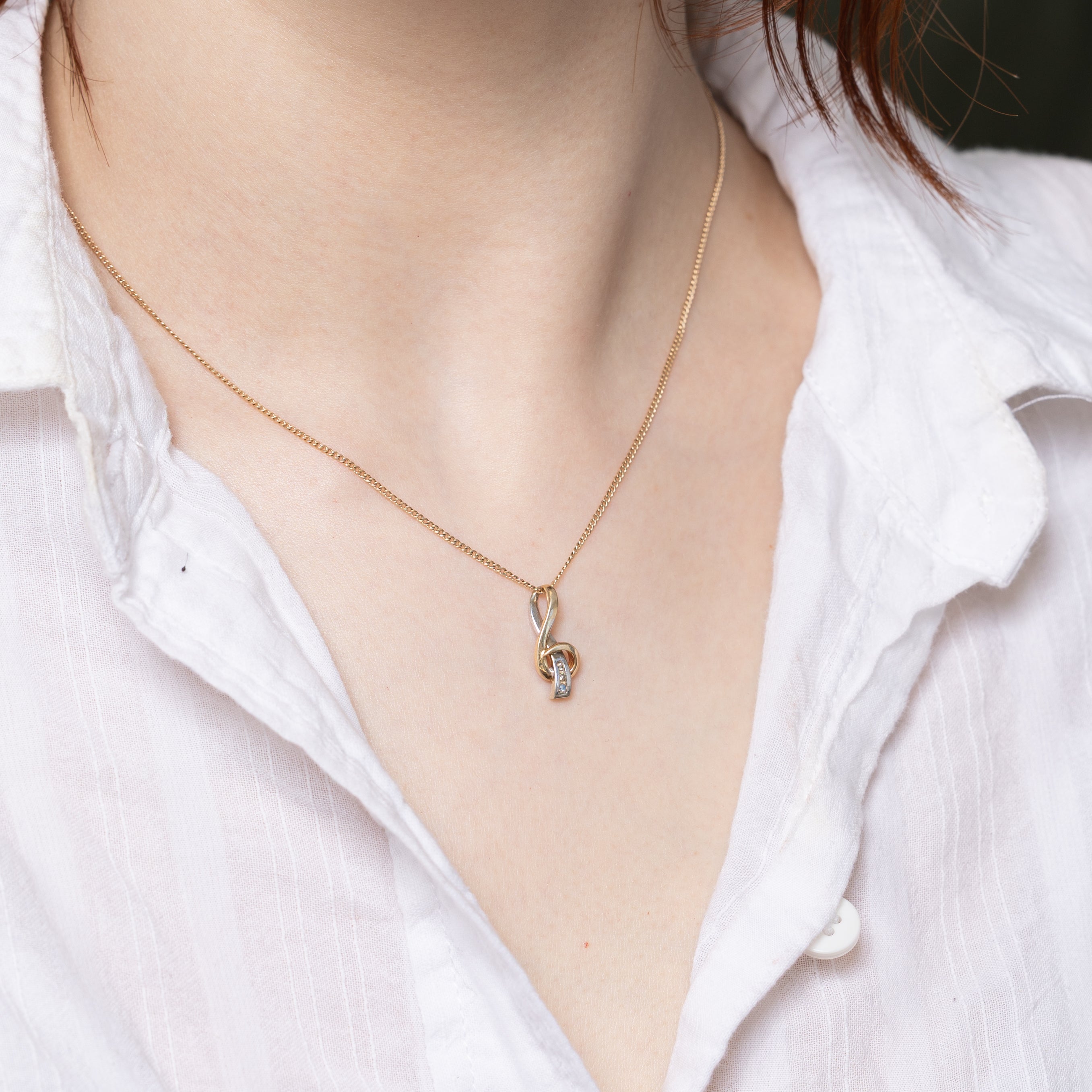 10k Two Tone Gold Diamond Swirl Pendant