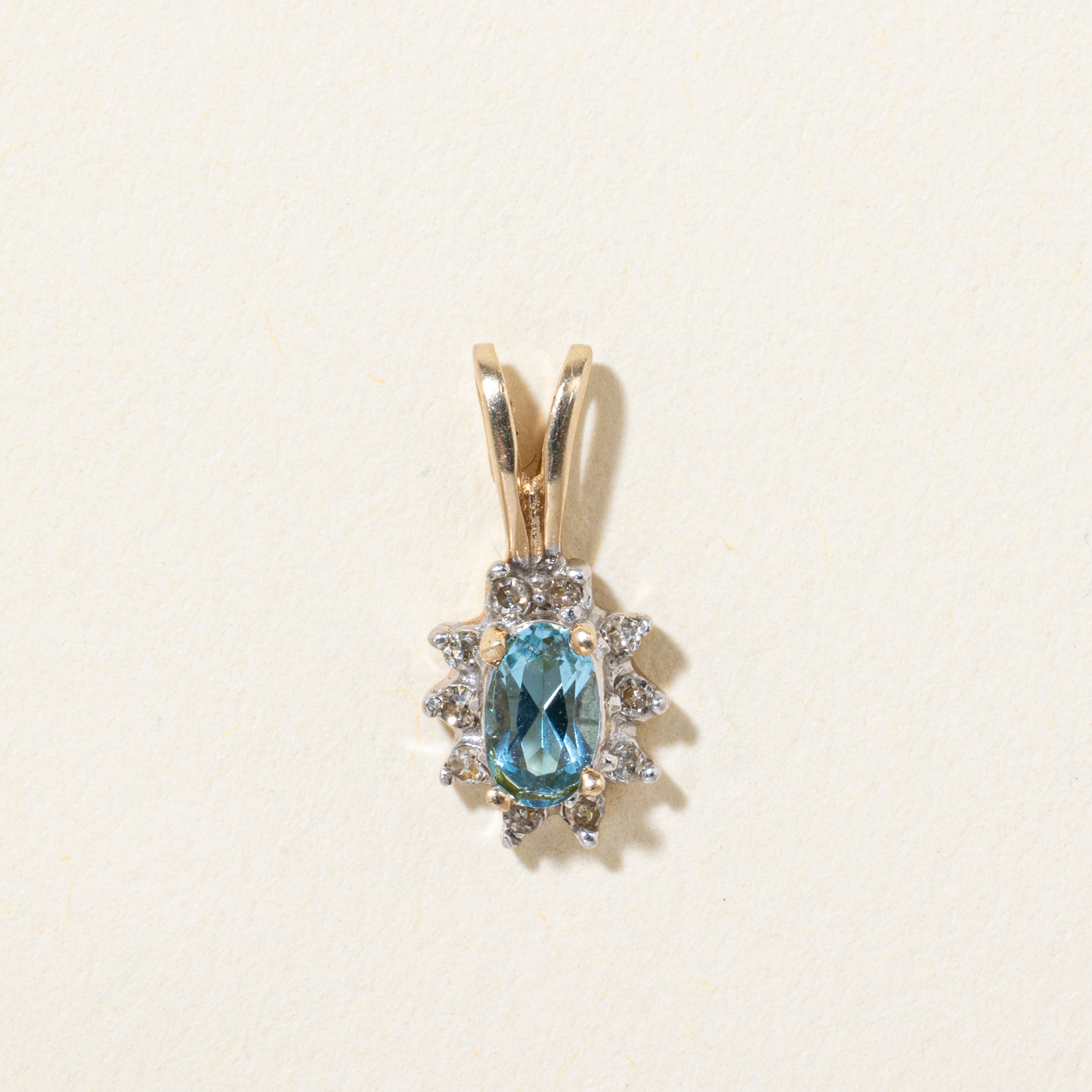10k Blue Topaz & Diamond Halo Pendant