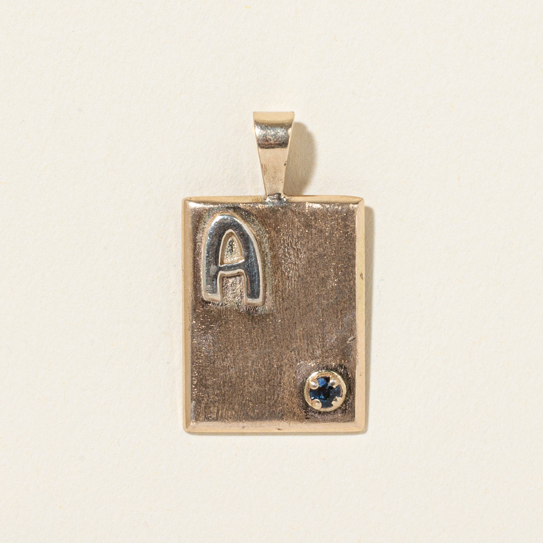 10k Sapphire "A" Initialized Sheet Pendant | 0.09ct