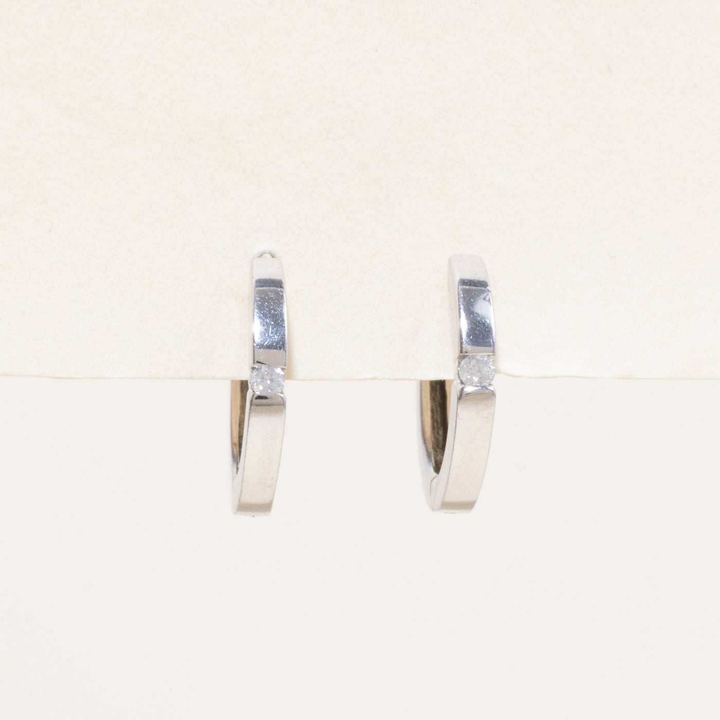 10k Single Diamond Huggie Earrings | 0.04ctw