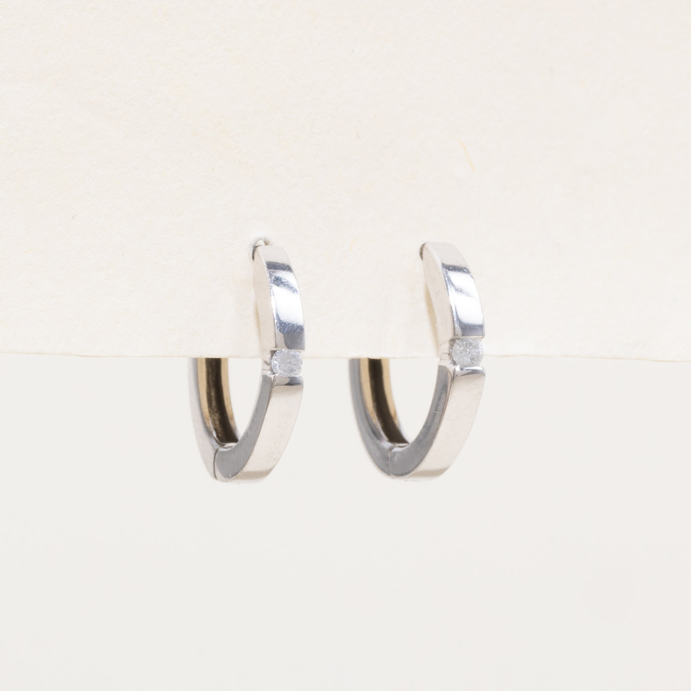 10k Single Diamond Huggie Earrings | 0.04ctw