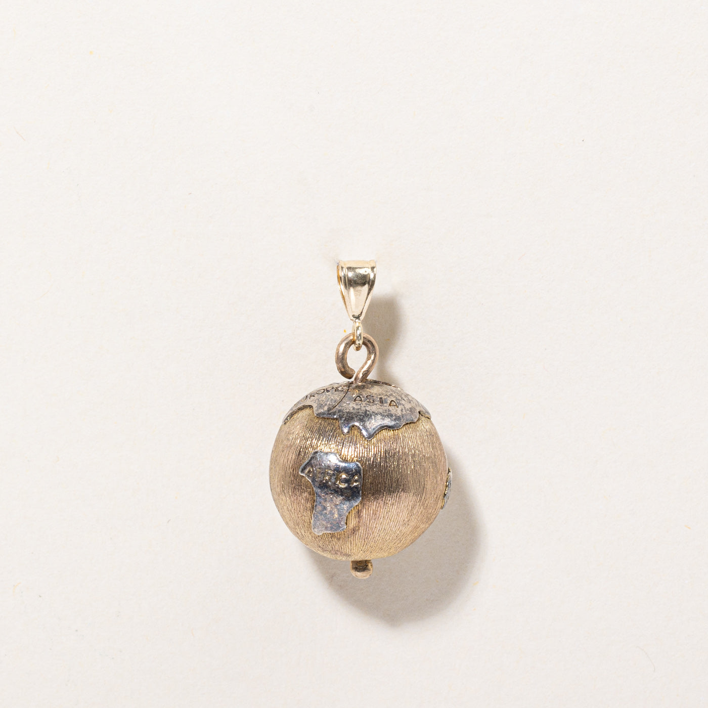 Pendentif globe tournant bicolore en or 14 carats