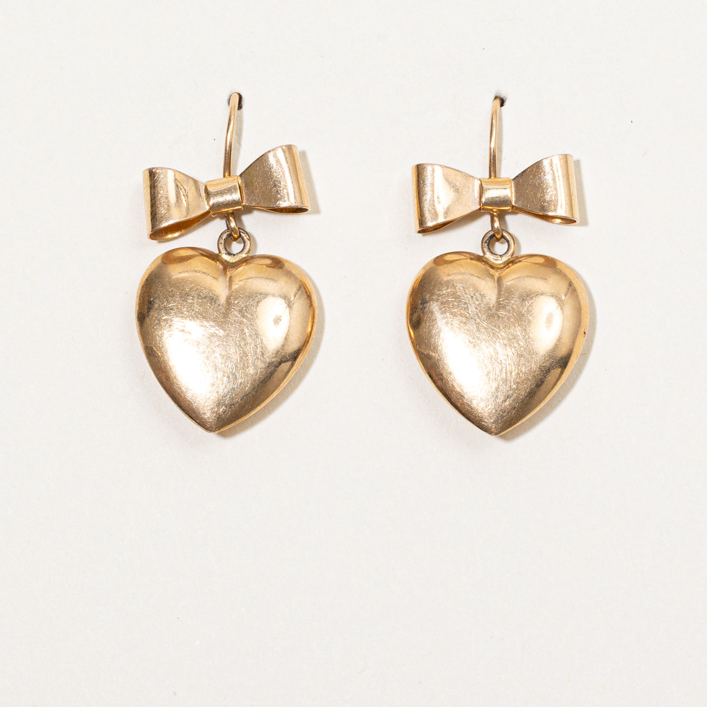Boucles d'oreilles nœud et cœur en or jaune 14 carats