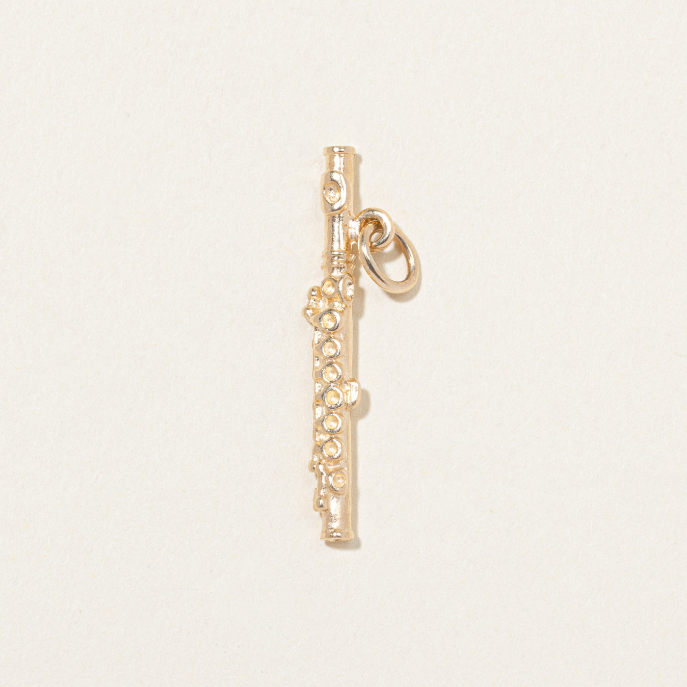 Breloque flûte en or jaune 10 carats