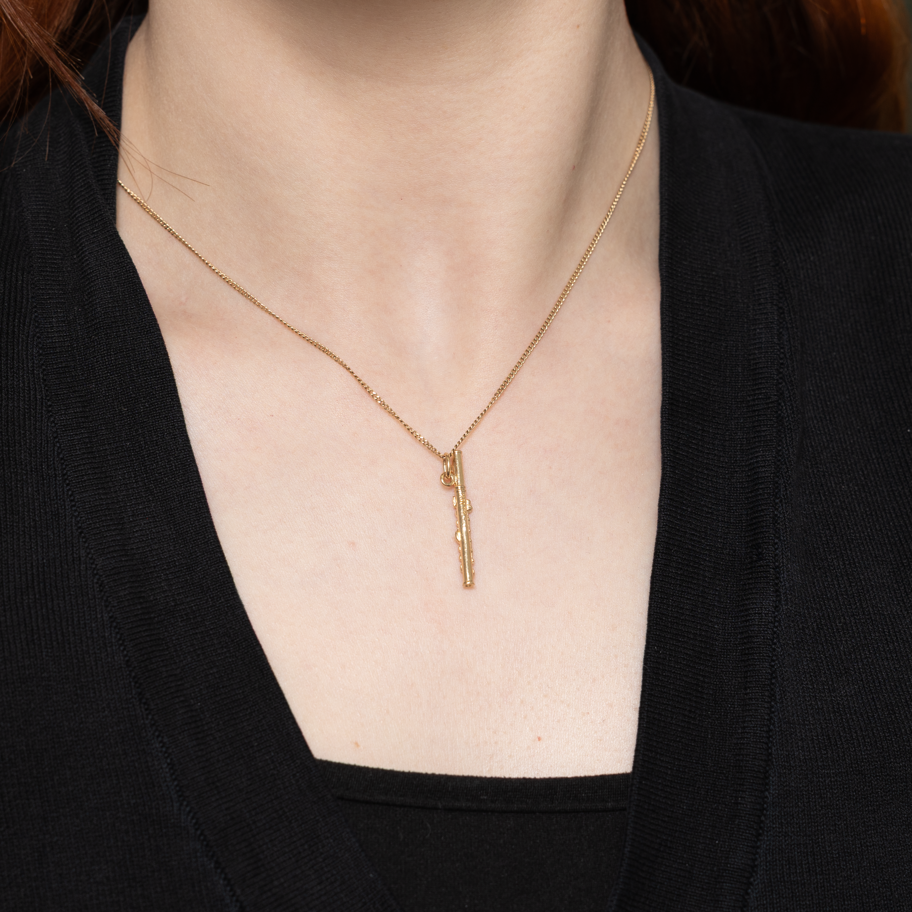 Breloque flûte en or jaune 10 carats