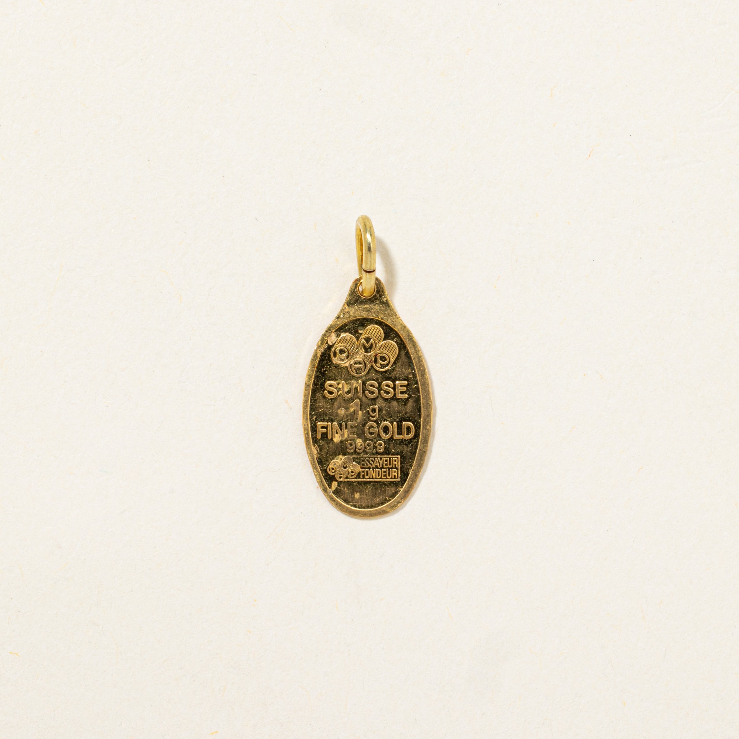 Breloque suisse en or jaune 24 carats (1 gramme)