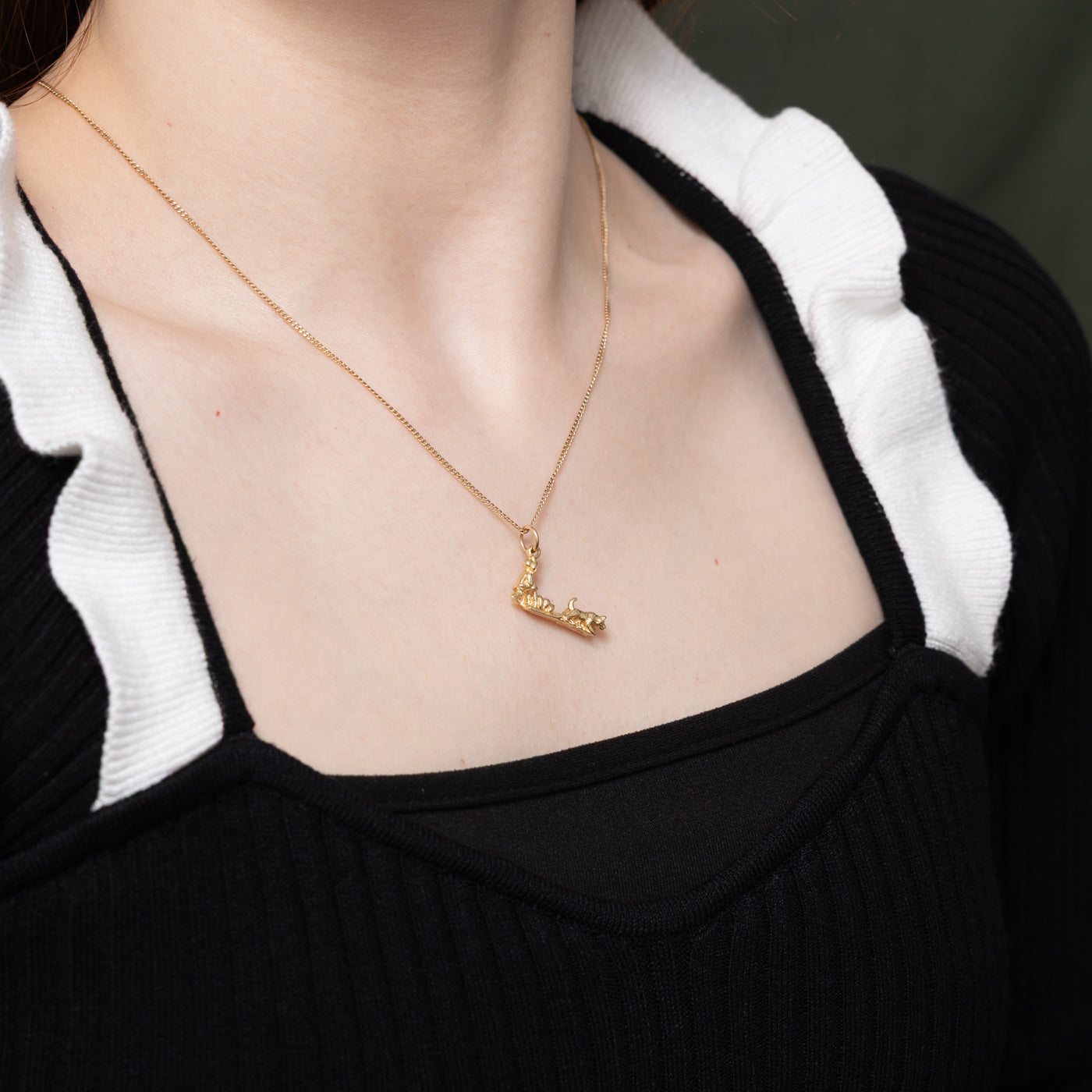 Breloque en or jaune 14 carats représentant un traîneau à chiens