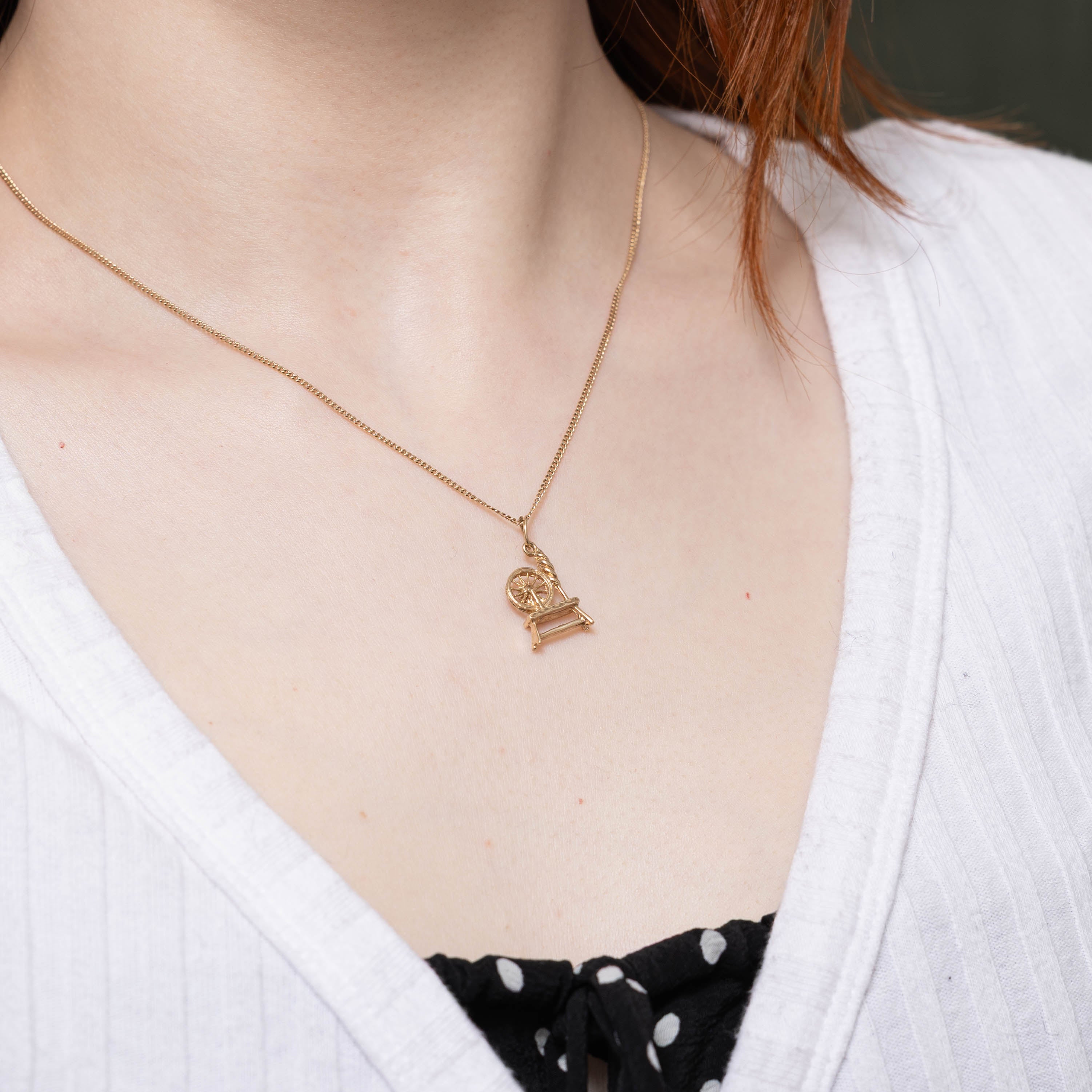 10k Spinning Wheel Charm