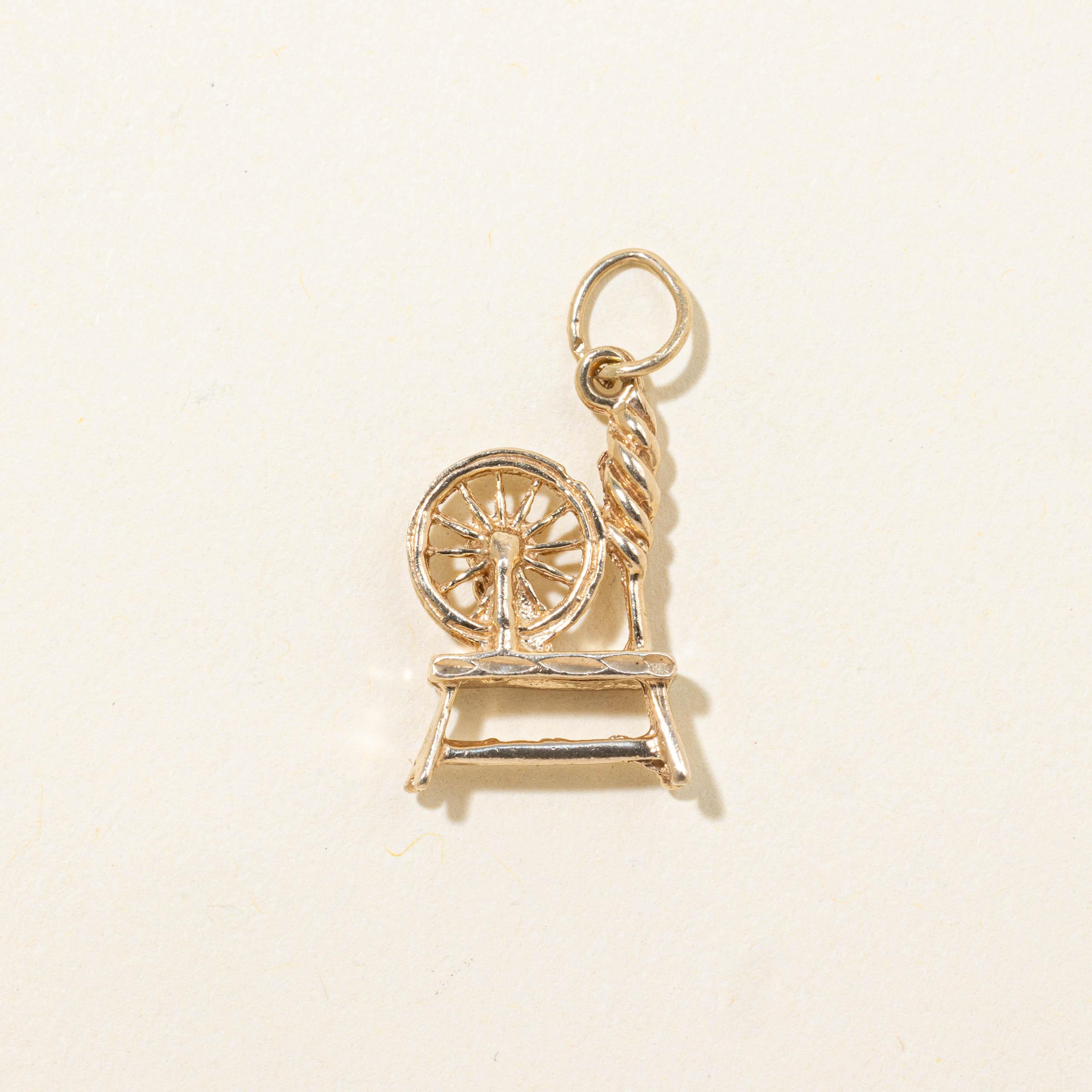 10k Spinning Wheel Charm