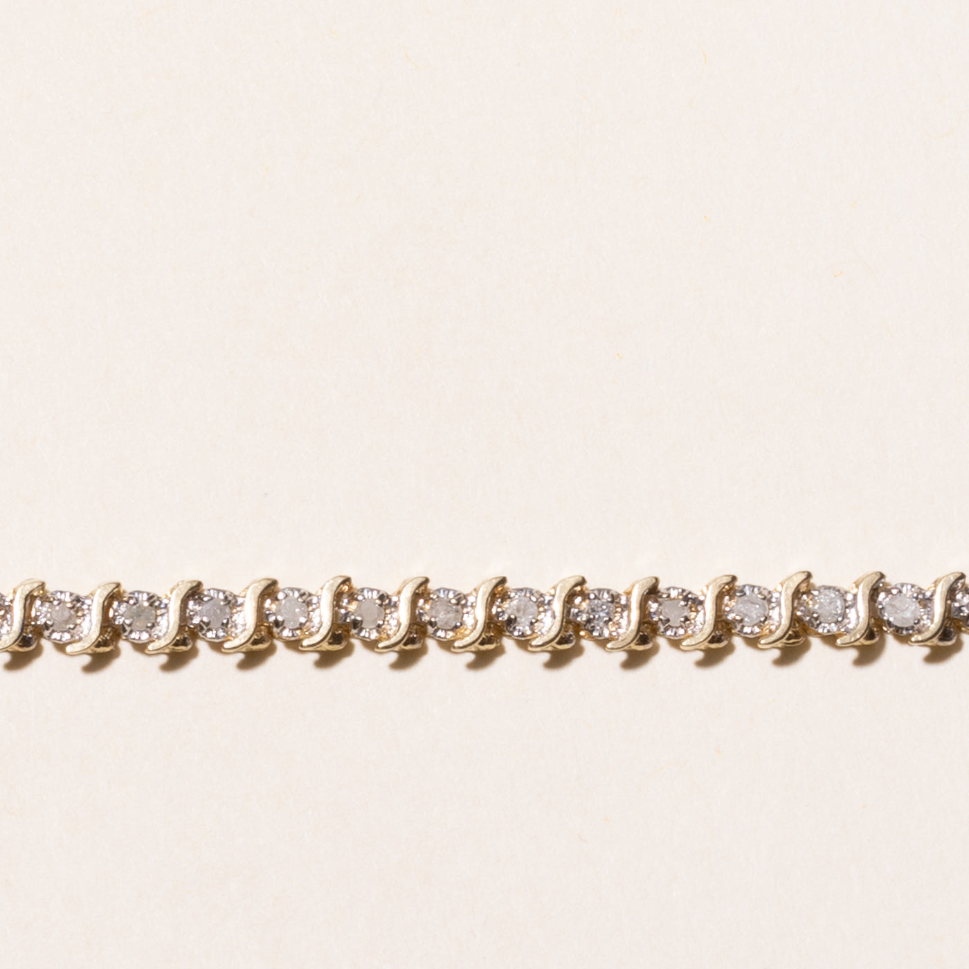 Yellow Gold Illusion Set Diamond Wave Tennis Bracelet | 0.69ctw | 7.5"