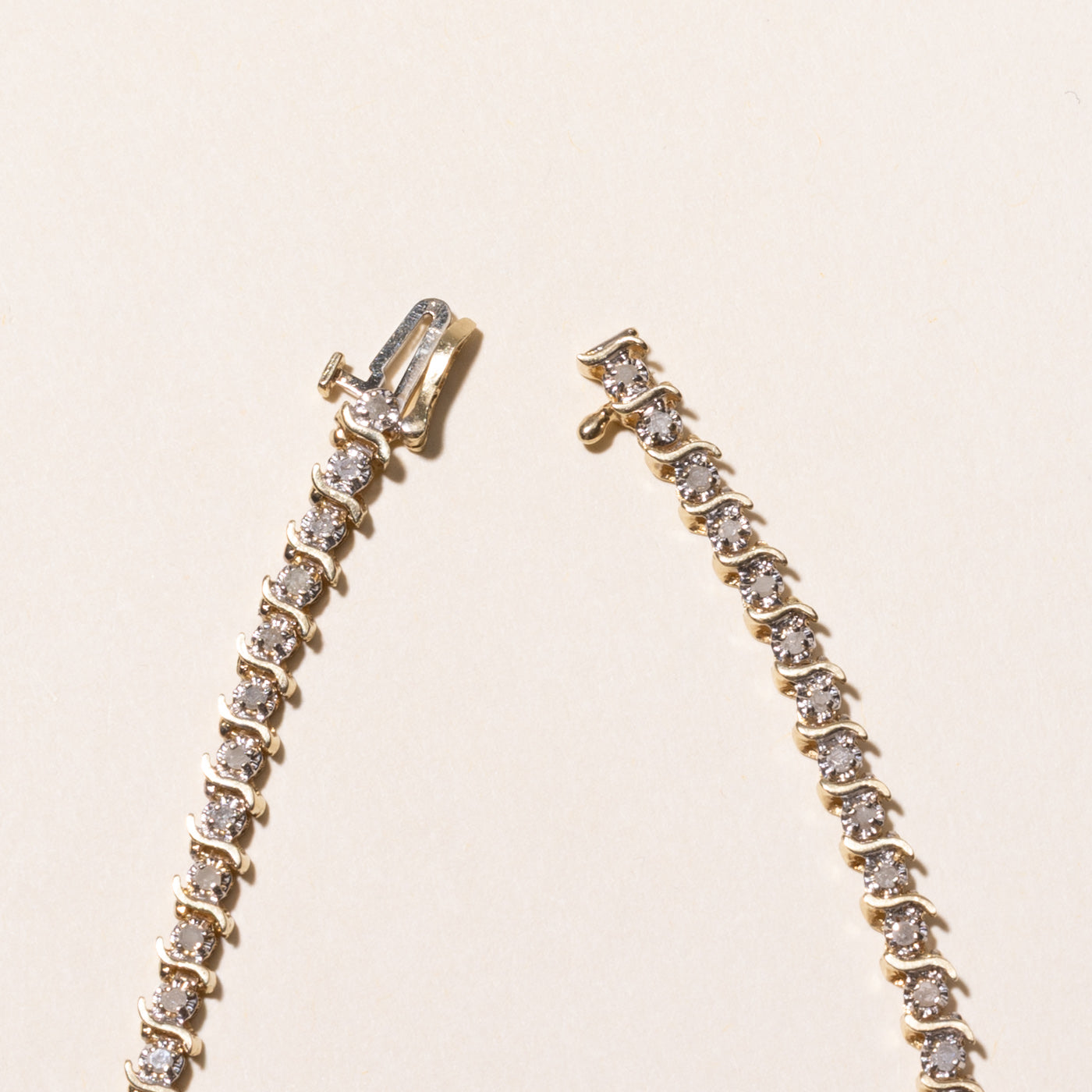 Yellow Gold Illusion Set Diamond Wave Tennis Bracelet | 0.69ctw | 7.5"