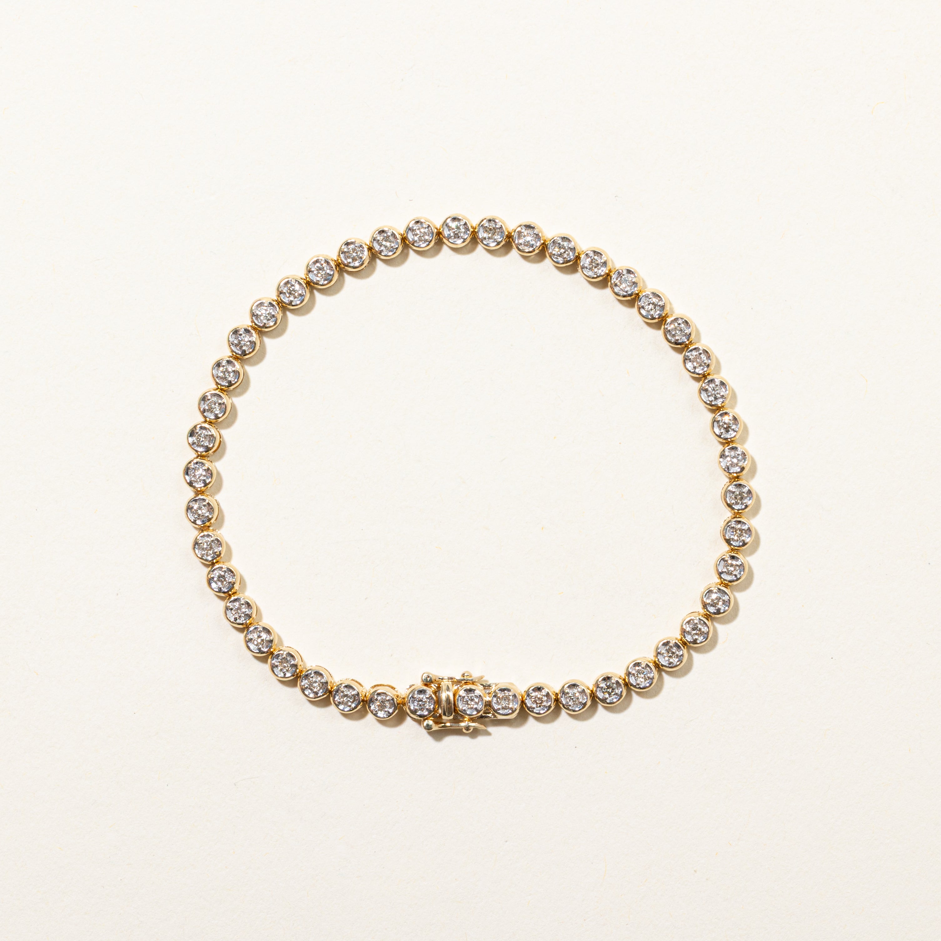 Yellow Gold Illusion Set Diamond Tennis Bracelet | 0.90ctw | 7.5"
