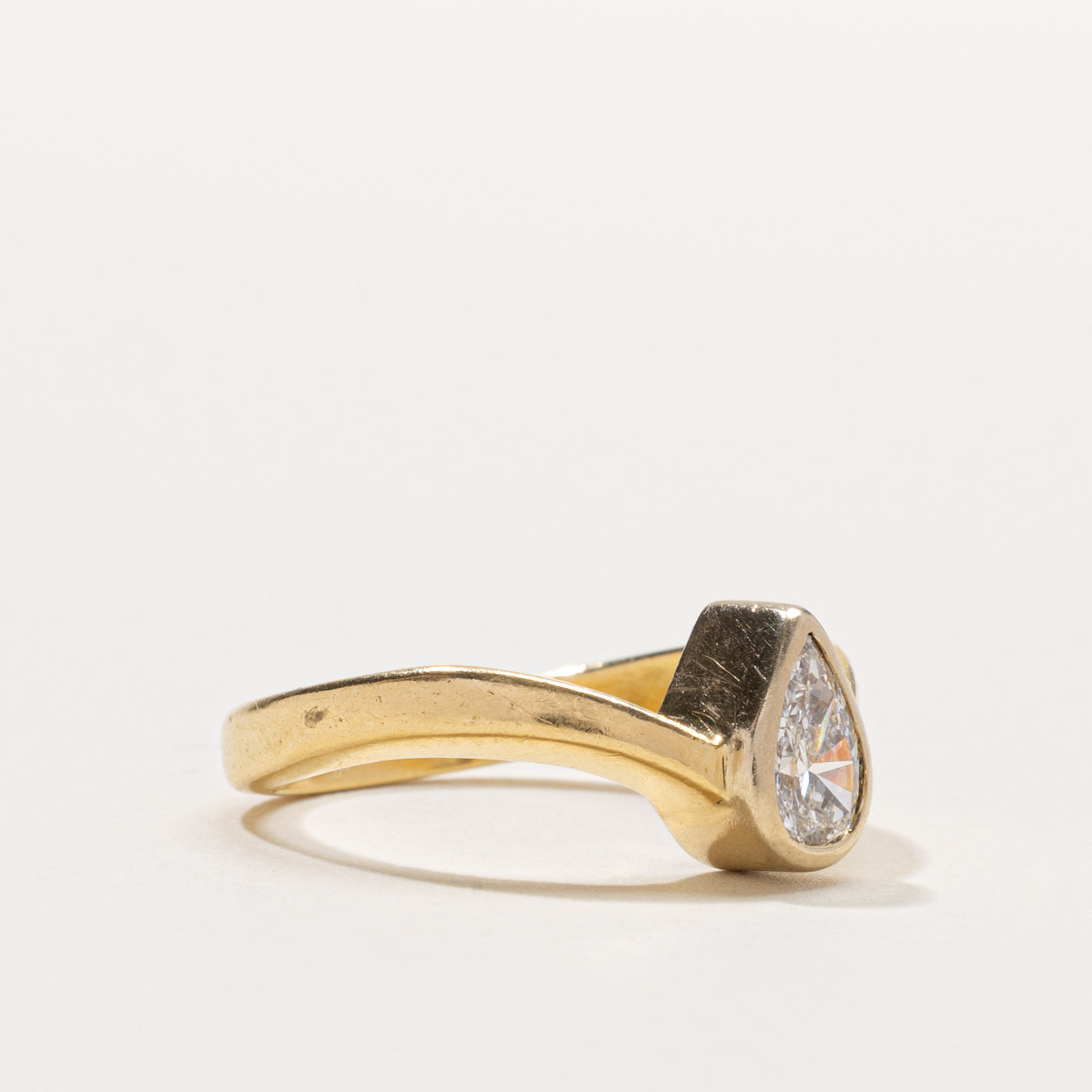 18k Pear Cut Bezel Set Diamond Curved Ring | 0.60ct VS2 G/H | SZ 6