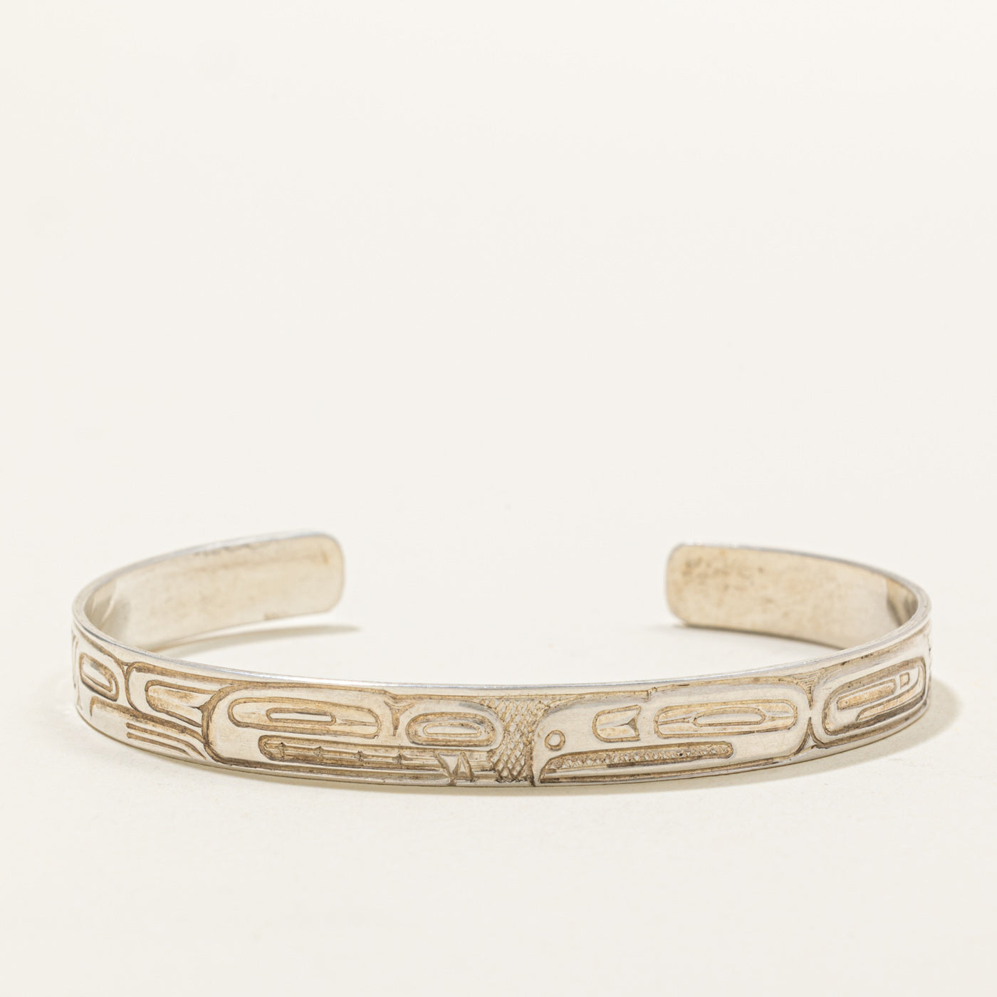 'Ding Hutchingson' Sterling Silver Indigenous Carved Beaver & Eagle Cuff | 5.5"