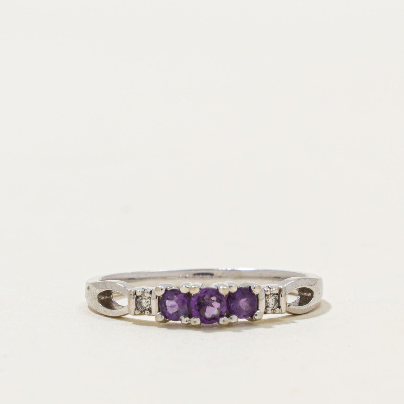 10k Three Stone Amethyst & Diamond Accented Ring | 0.20ctw, 0.02ctw | SZ 6.5