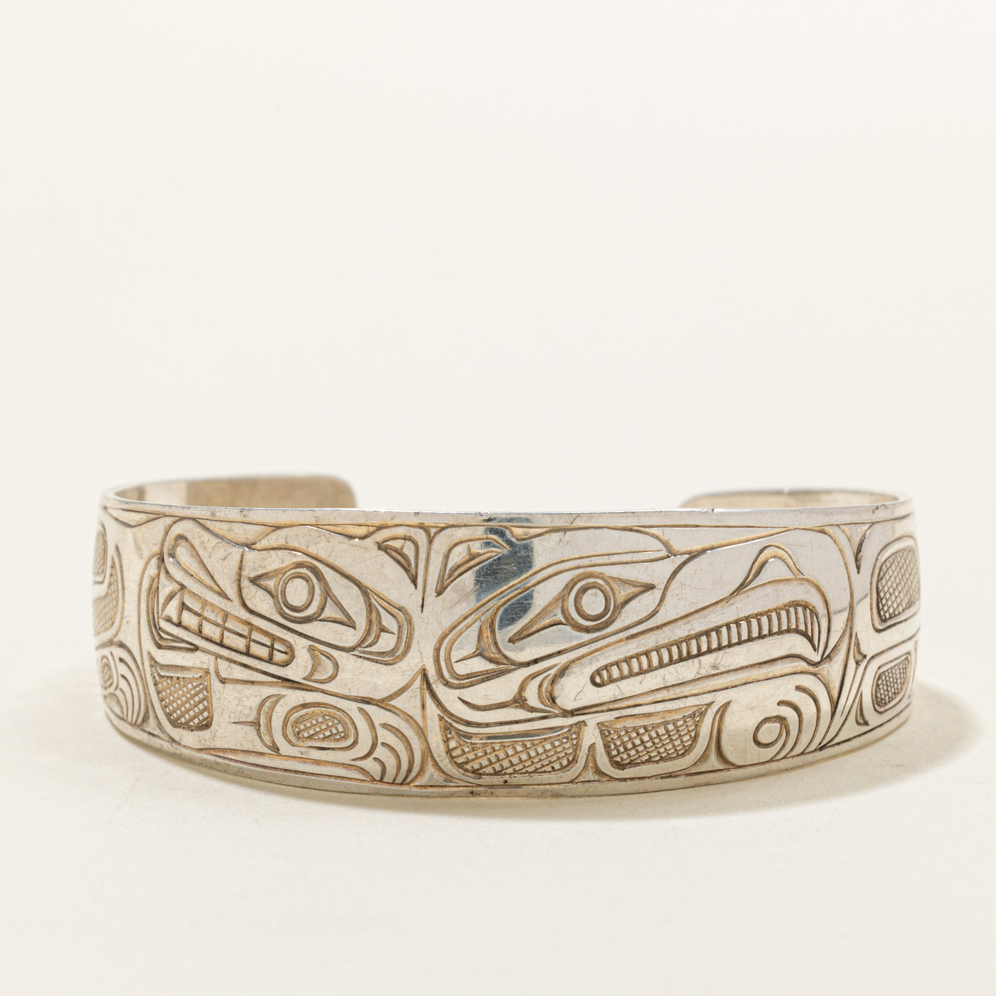 Sterling Silver Indigenous Carved Wolf & Thunderbird Cuff | 6"