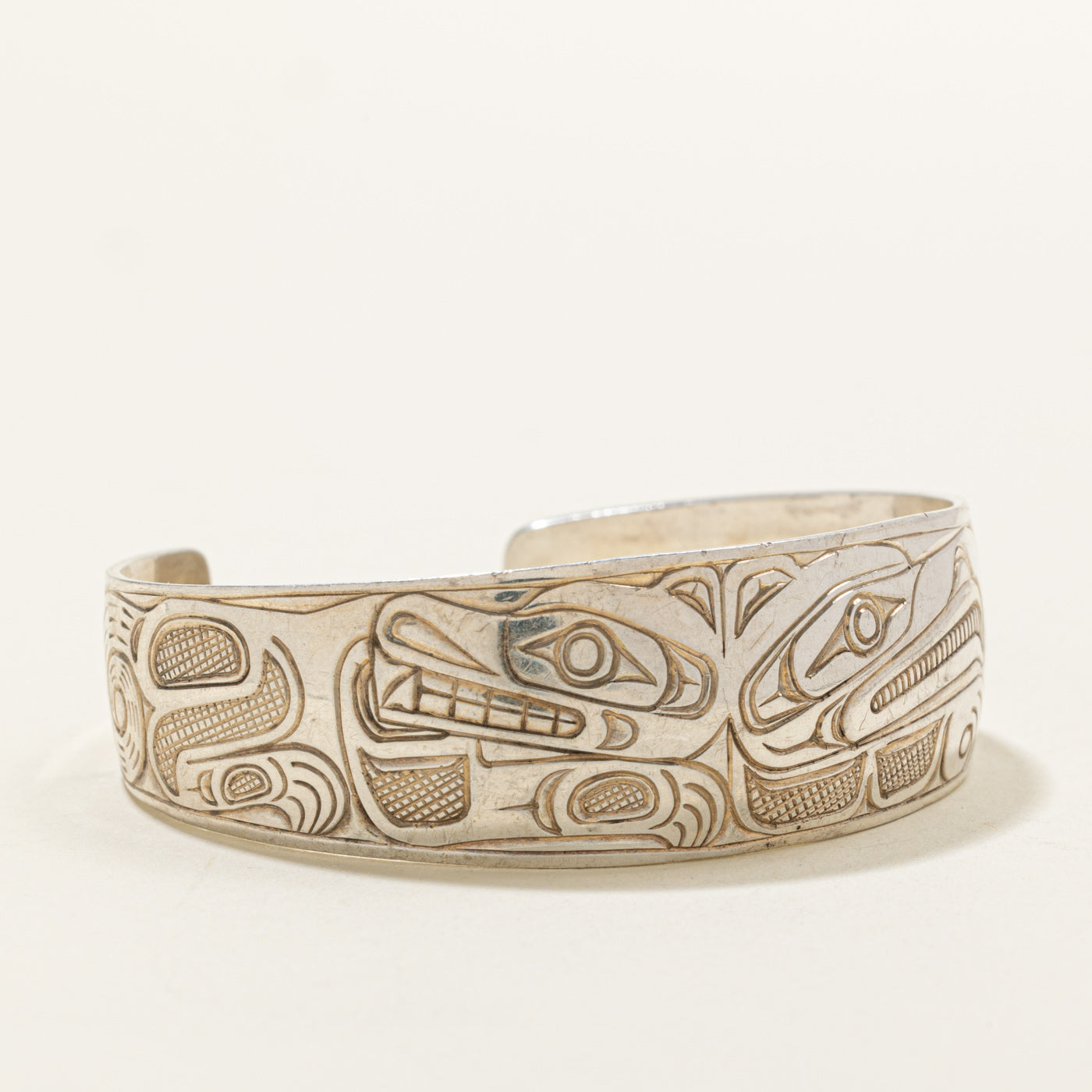 Sterling Silver Indigenous Carved Wolf & Thunderbird Cuff | 6"