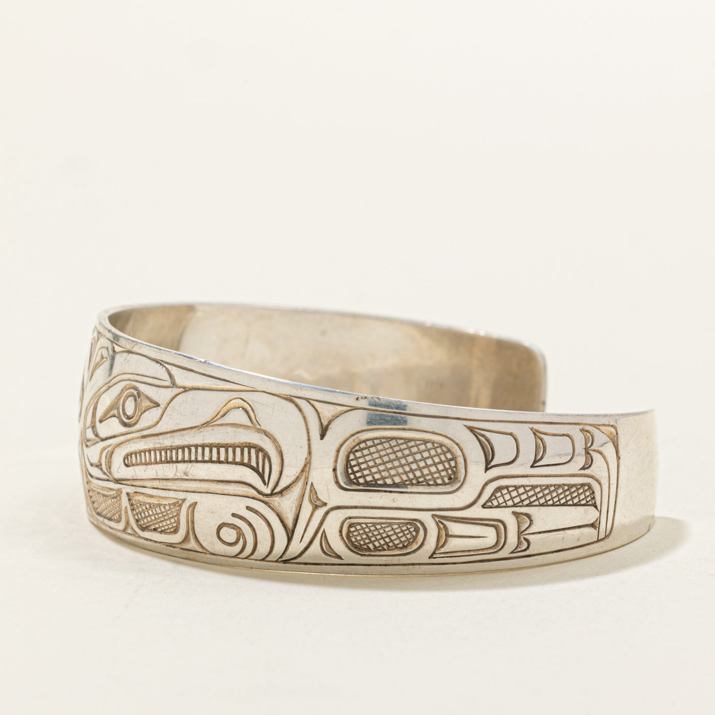 Sterling Silver Indigenous Carved Wolf & Thunderbird Cuff | 6"