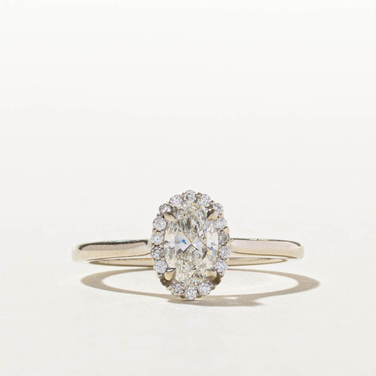 14k GIA Oval Cut Diamond Halo Ring | GIA 0.70ct SI1 H, 0.14ctw | SZ 8