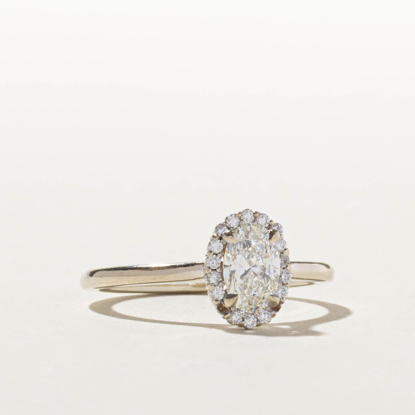 14k GIA Oval Cut Diamond Halo Ring | GIA 0.70ct SI1 H, 0.14ctw | SZ 8