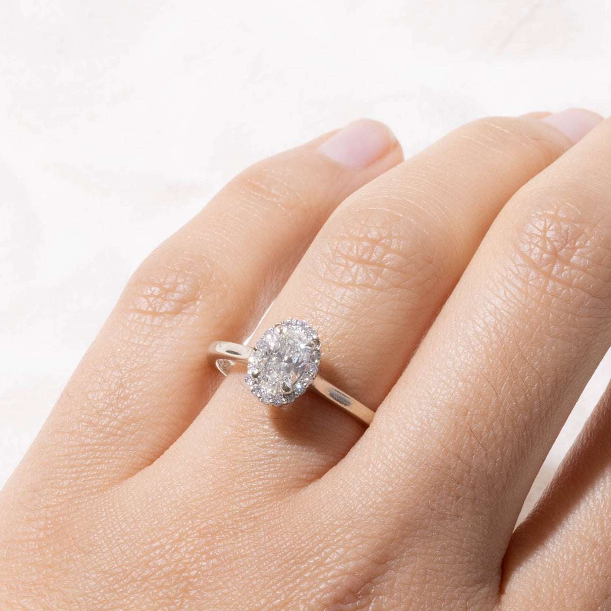 14k GIA Oval Cut Diamond Halo Ring | GIA 0.70ct SI1 H, 0.14ctw | SZ 8