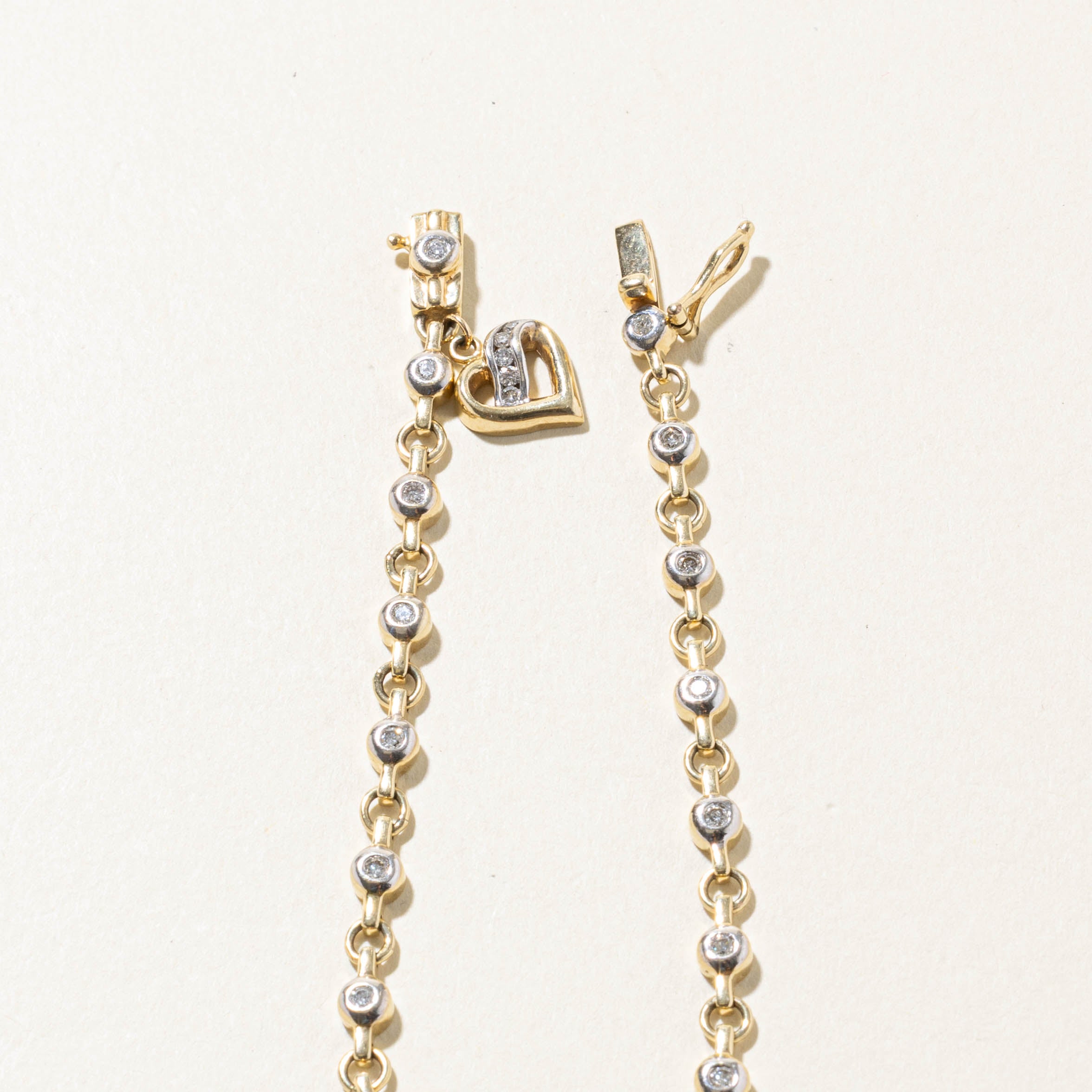 10k Two Tone Bezel Set Diamond Heart Charm Bracelet | 0.40ctw | 7.5"