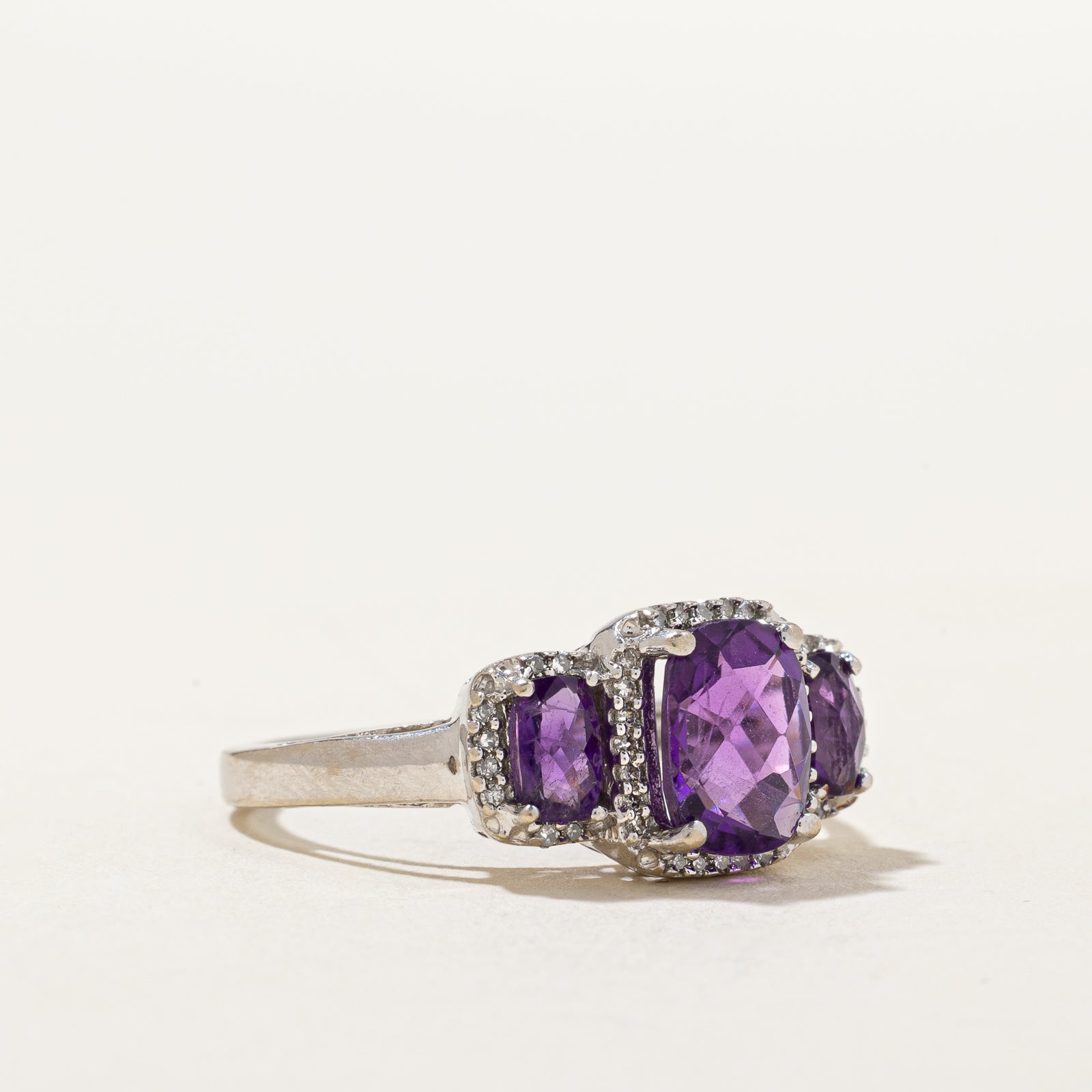 Three Stone Amethyst & Diamond Halo Ring | 1.70ctw, 0.08ctw | SZ 7 |