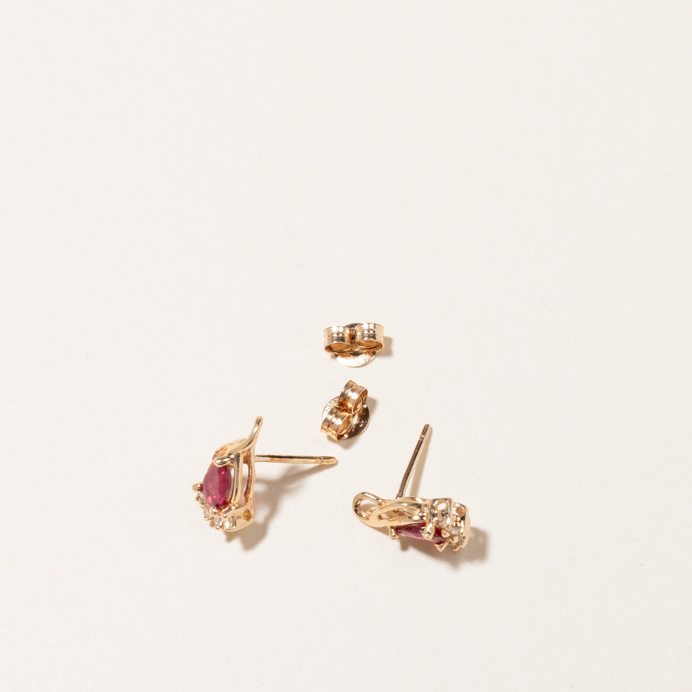 14K Pear Cut Synthetic Ruby & Diamond Stud Earrings | 0.40ctw, 0.04ctw