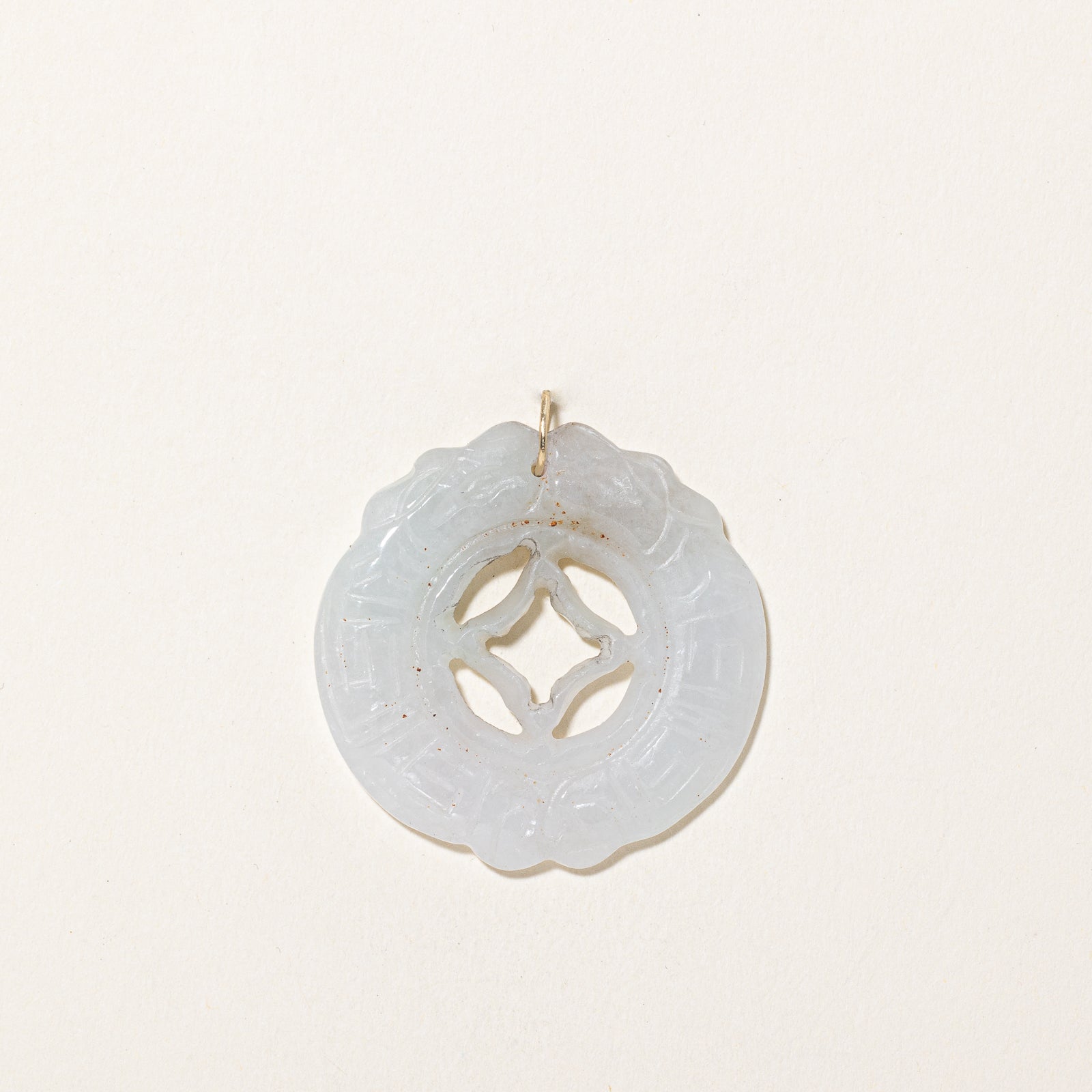 Carved Circular Jadeite Pendant | 43.00ct