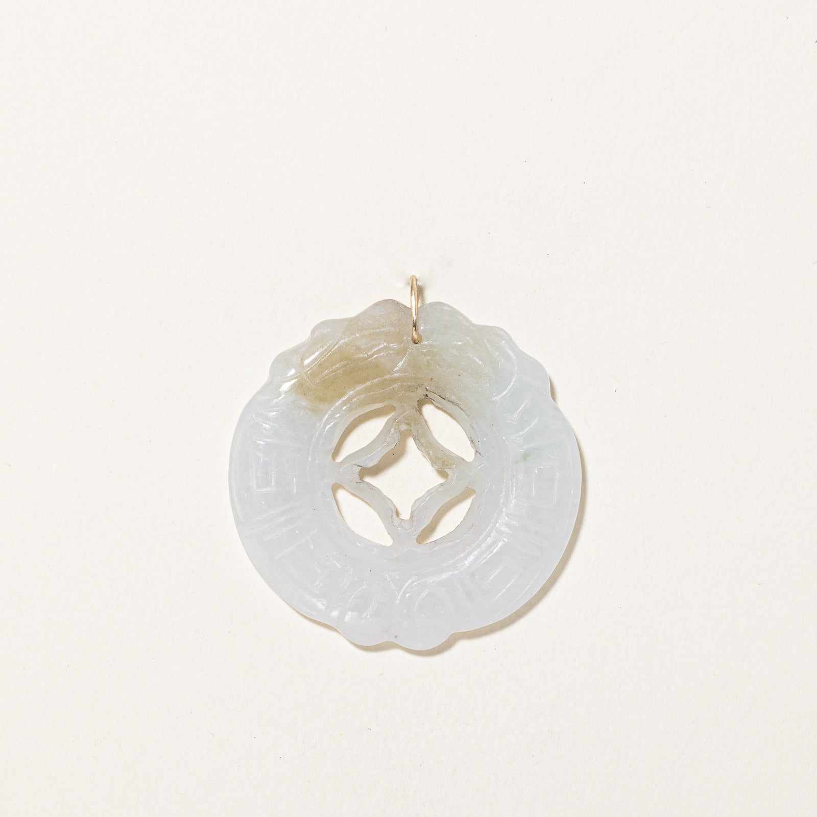 Carved Circular Jadeite Pendant | 43.00ct