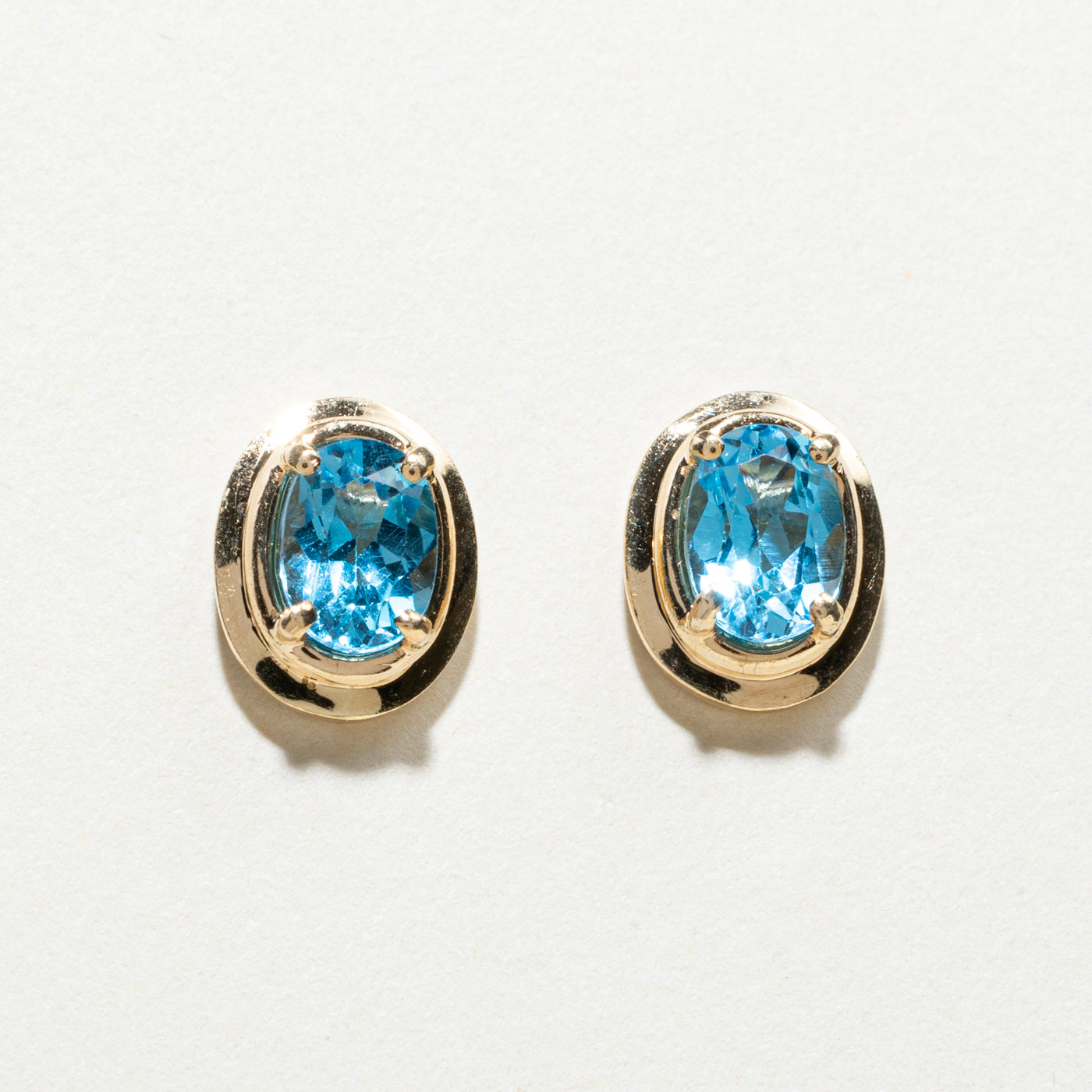 14K Oval Cut Blue Topaz Stud Earrings | 1.50ctw