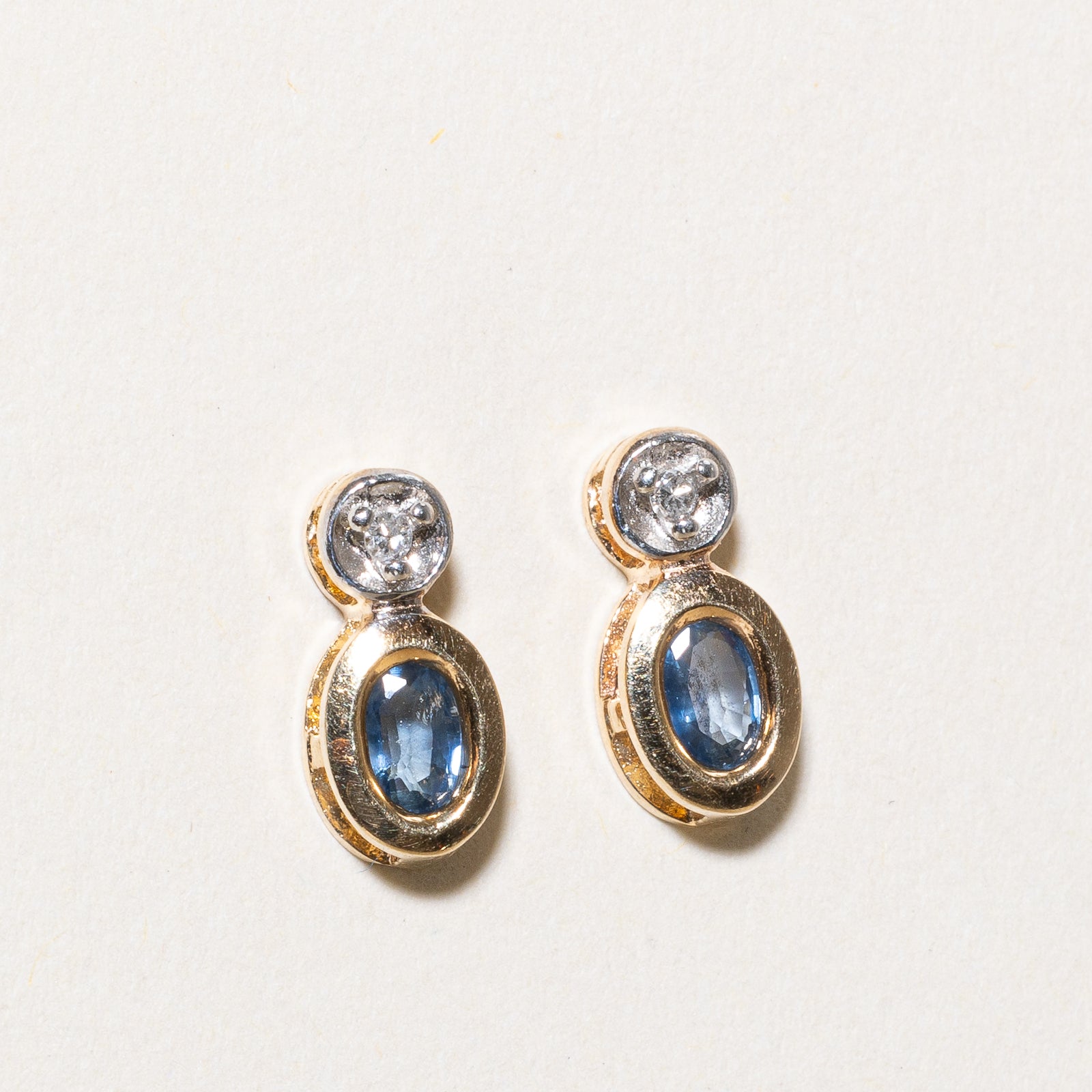 Bezel Set Oval Cut Sapphire & Diamond Stud Earrings | 0.50ctw, 0.02ctw |