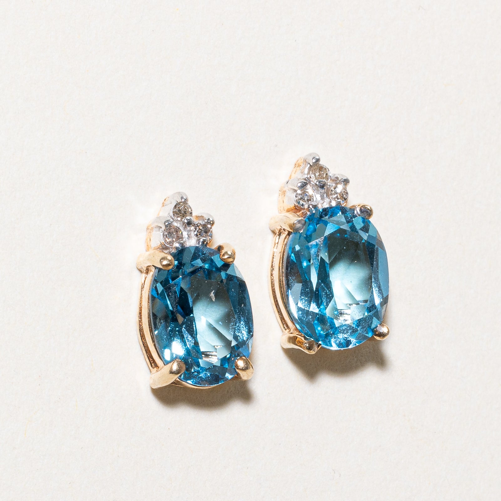 Oval Cut Blue Topaz & Diamond Stud Earrings | 3.00ctw, 0.03ctw |