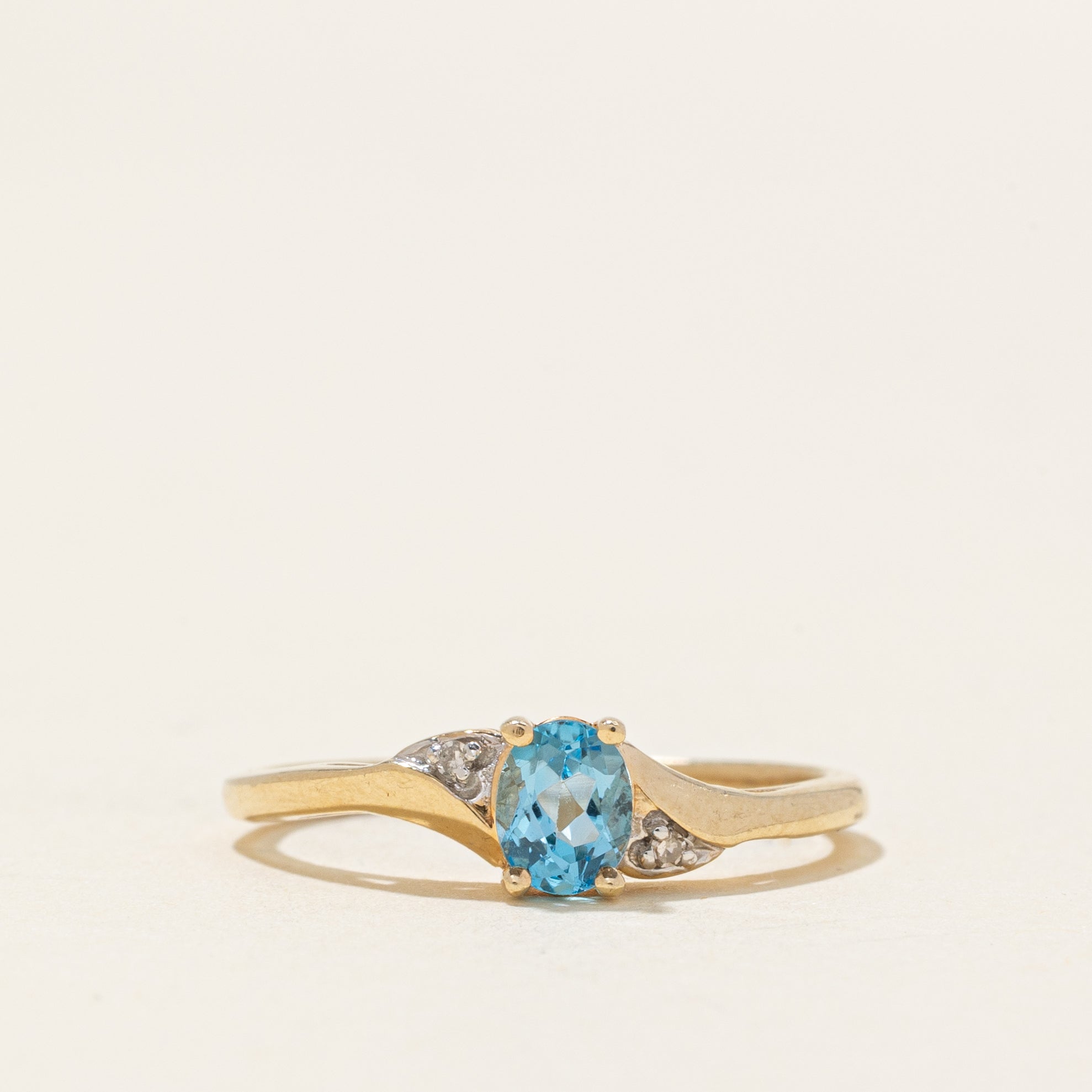 Oval Cut Blue Topaz & Diamond Accented Bypass Ring | 0.22ct, 0.01ctw | SZ 4.75