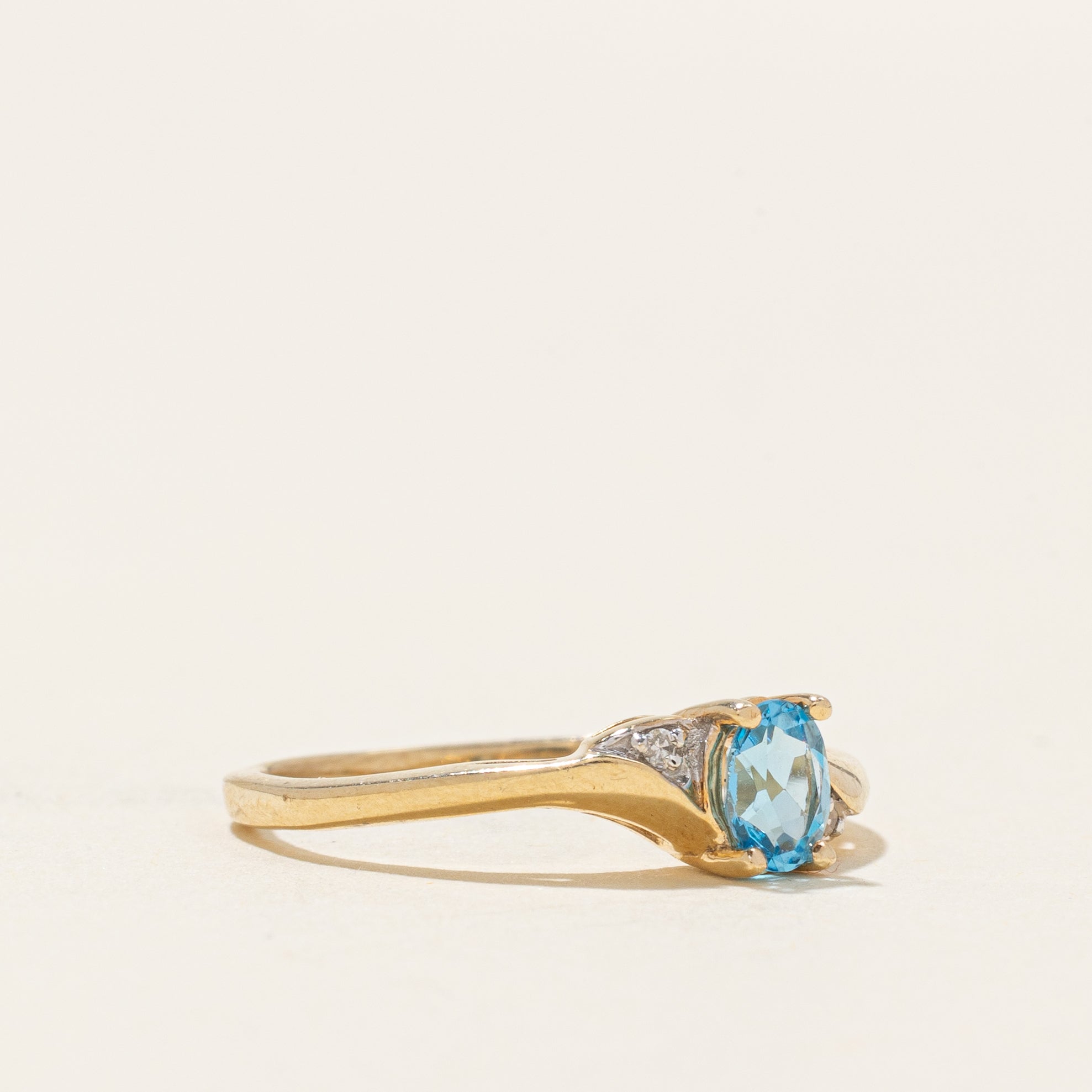 Oval Cut Blue Topaz & Diamond Accented Bypass Ring | 0.22ct, 0.01ctw | SZ 4.75