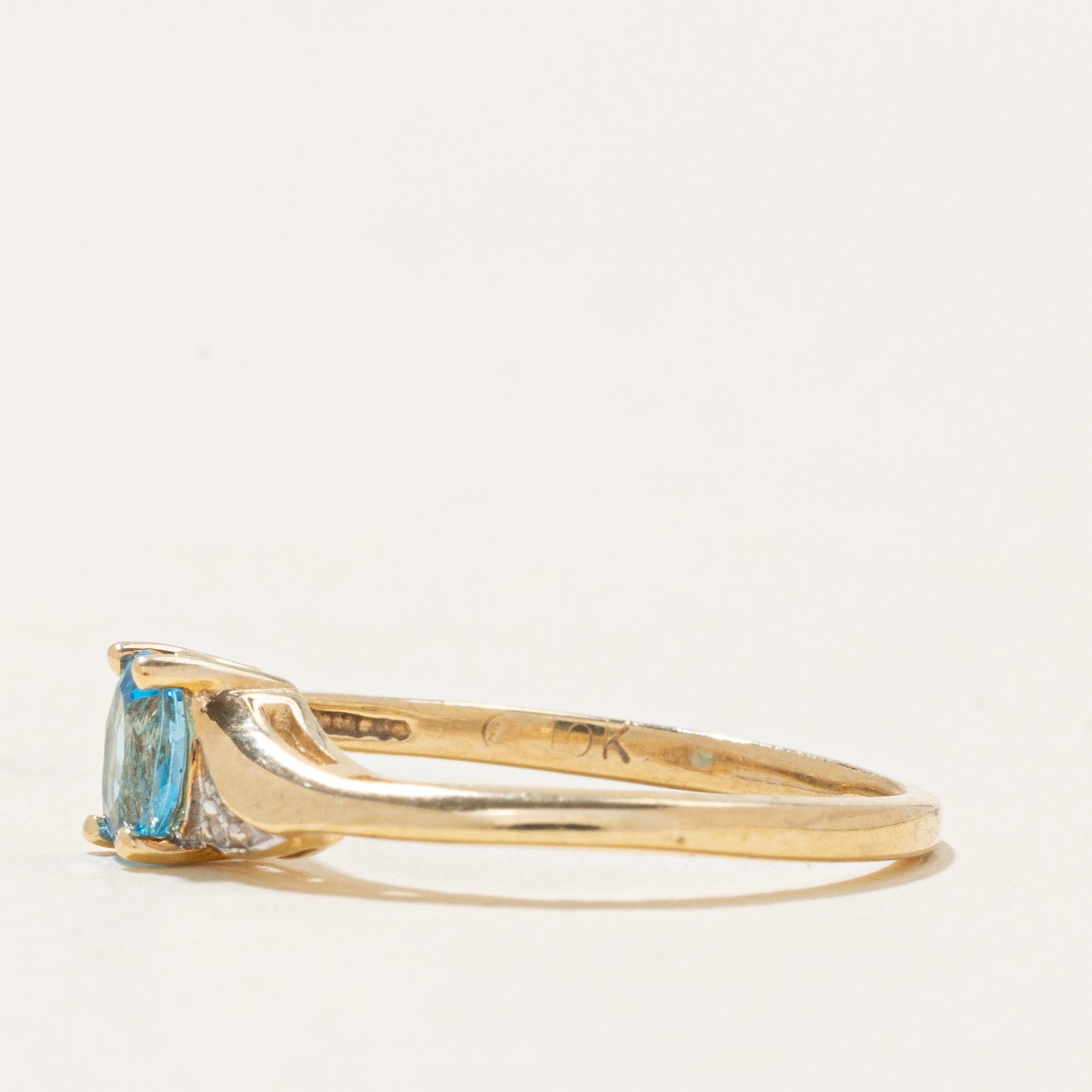 Oval Cut Blue Topaz & Diamond Accented Bypass Ring | 0.22ct, 0.01ctw | SZ 4.75