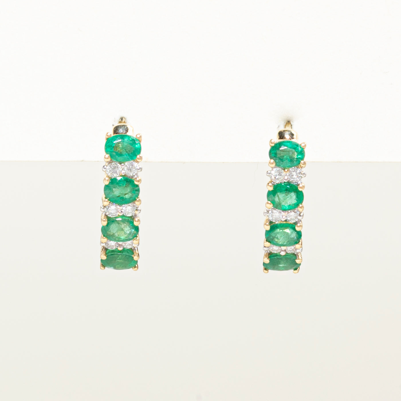 Oval Cut Emerald & Diamond Huggie Earrings | 1.50ctw, 0.18ct
