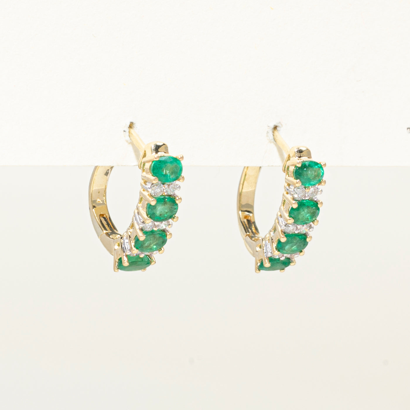 Oval Cut Emerald & Diamond Huggie Earrings | 1.50ctw, 0.18ct