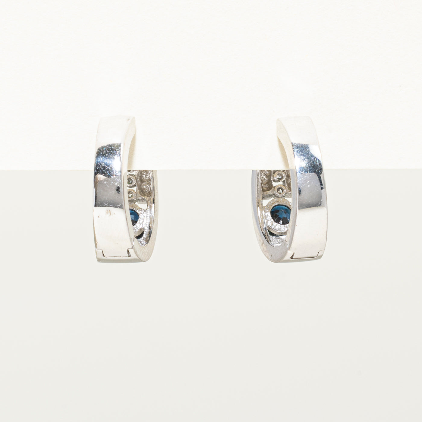 10k White Gold Sapphire & Diamond Huggie Earrings | 0.64ctw, 0.08ct