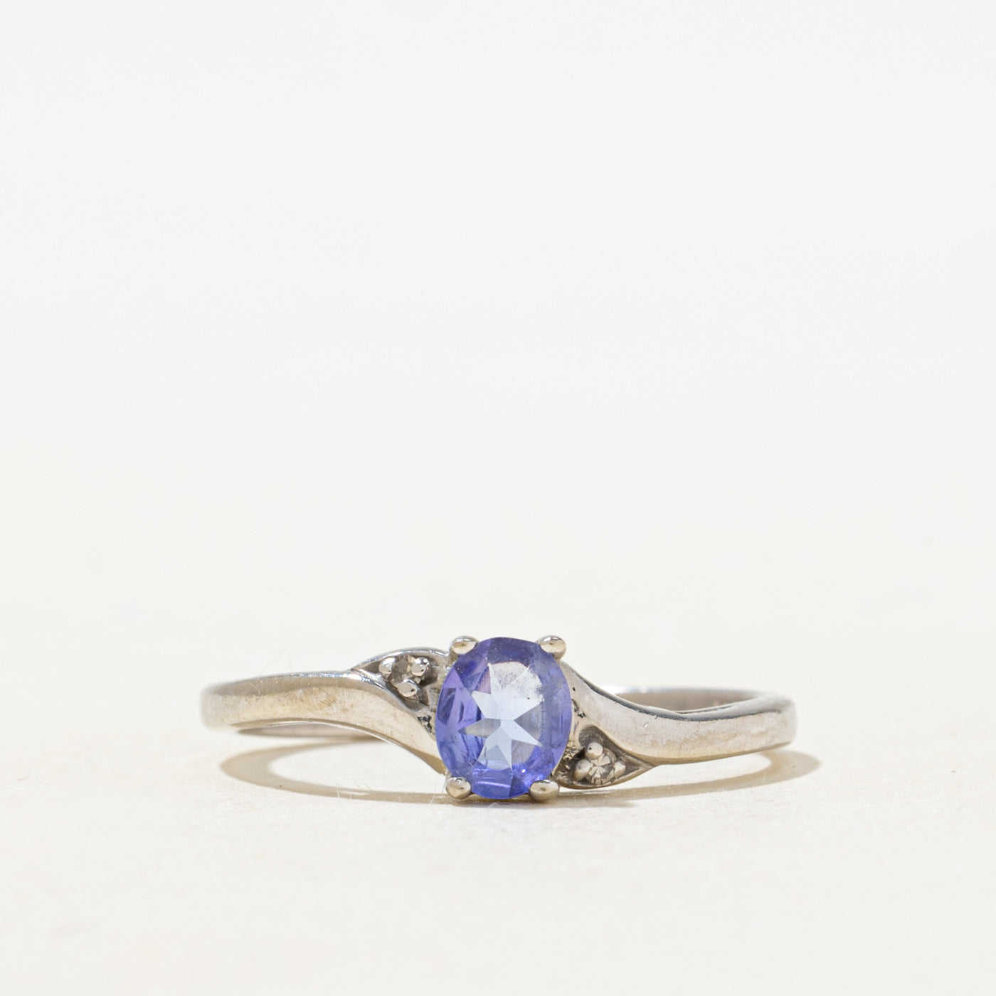 Oval Cut Tanzanite & Diamond Bypass Ring | 0.22ct, 0.01ctw | SZ 6.0 |
