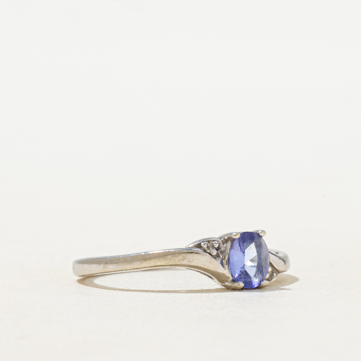Oval Cut Tanzanite & Diamond Bypass Ring | 0.22ct, 0.01ctw | SZ 6.0 |