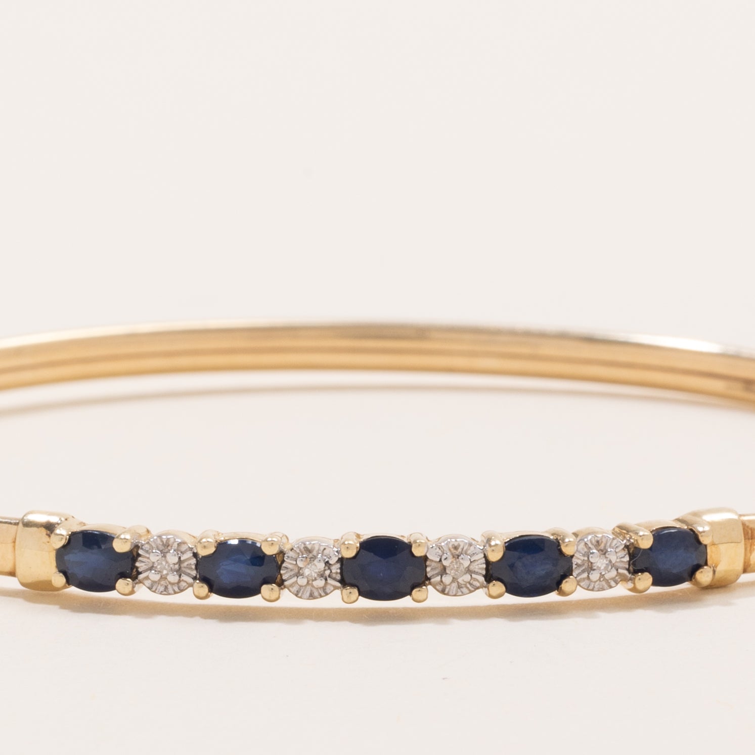 Oval Cut Sapphire & Diamond Cuff Bracelet | 1.25ctw, 0.02ctw | 7" |