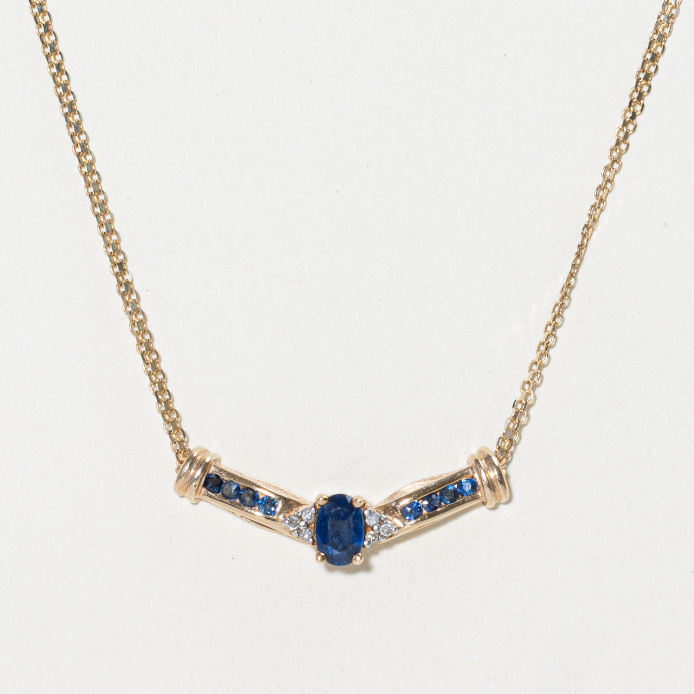 Oval Cut Sapphire & Diamond Pendant Necklace | 0.60ctw, 0.03ctw | 16"