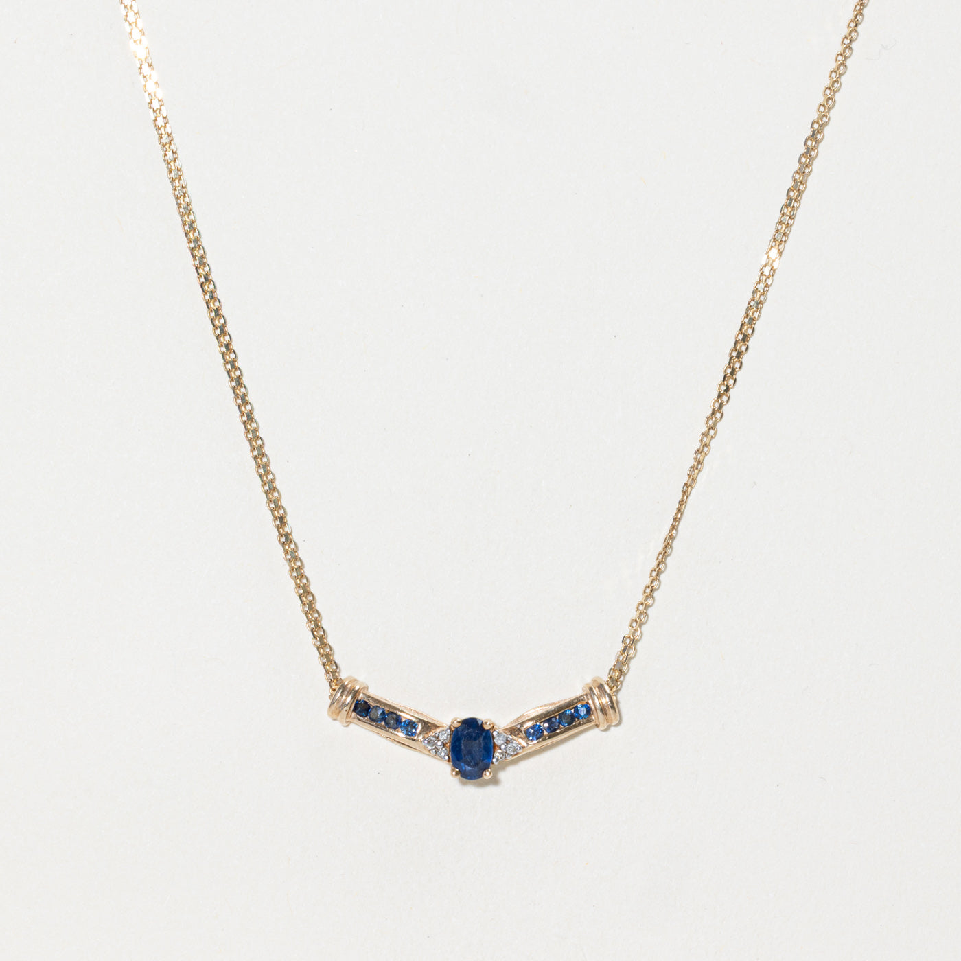Oval Cut Sapphire & Diamond Pendant Necklace | 0.60ctw, 0.03ctw | 16"