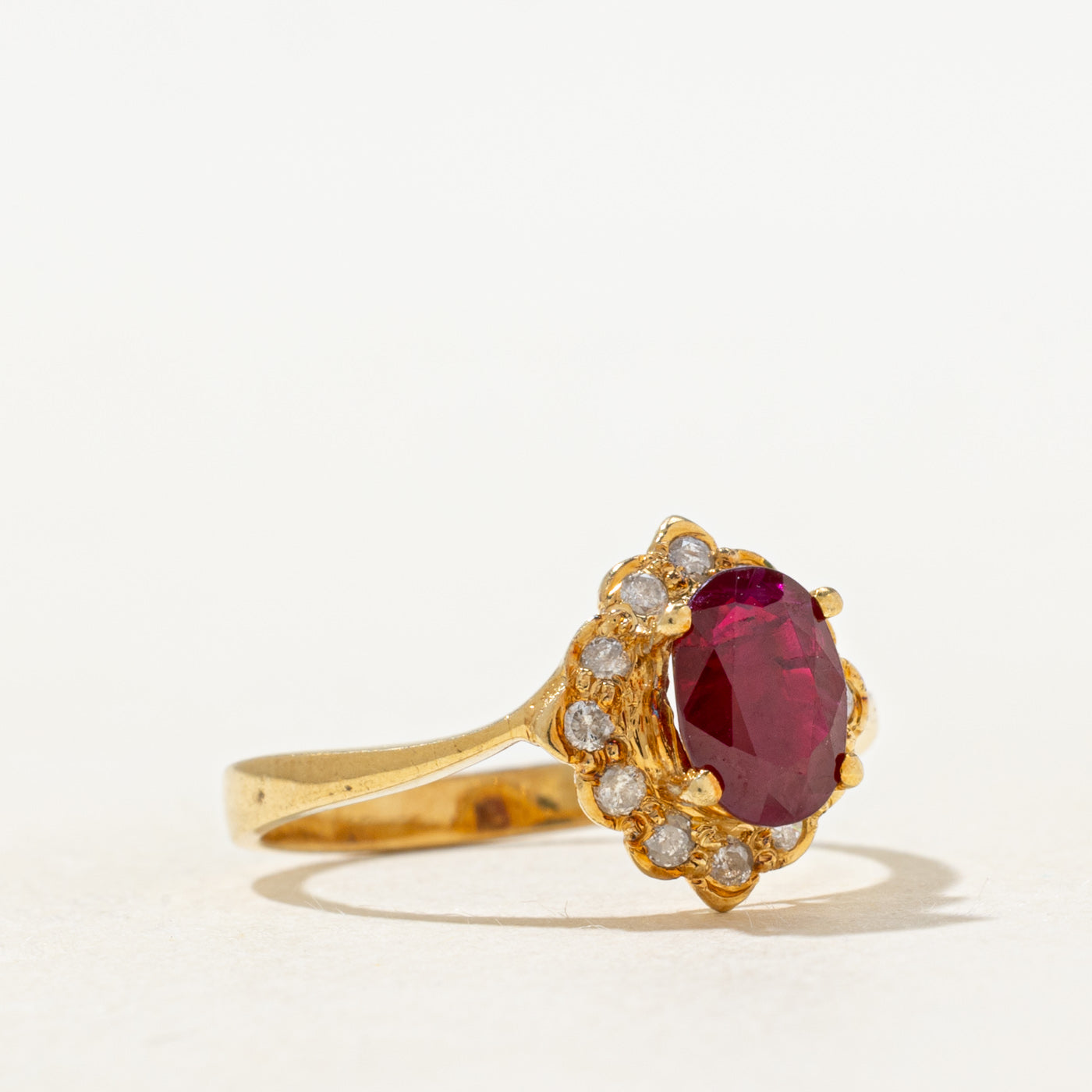 Oval Cut Ruby & Diamond Petal Halo Ring | 0.70ct, 0.06ctw | SZ 5.5