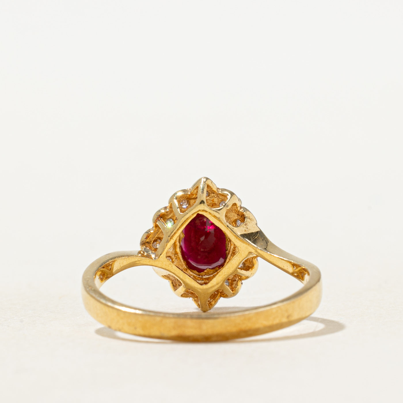 Oval Cut Ruby & Diamond Petal Halo Ring | 0.70ct, 0.06ctw | SZ 5.5