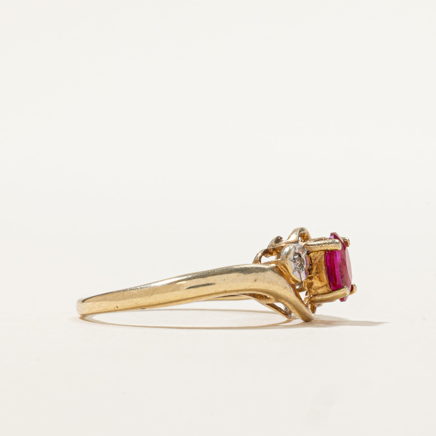 9k Oval Cut Synthetic Ruby & Diamond Bypass Ring | 0.50ct, 0.02ctw | SZ 6.5